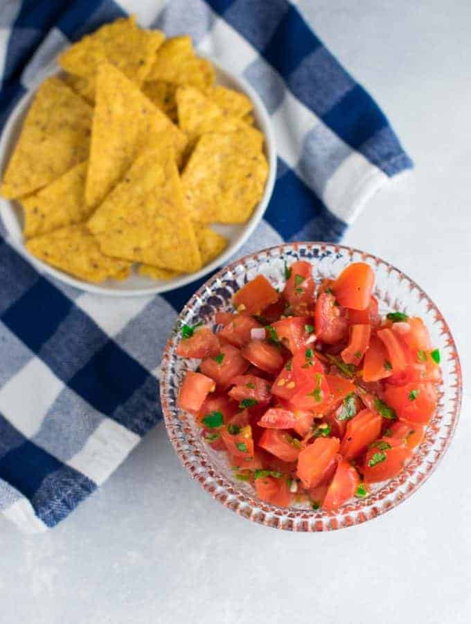 Easy Homemade Fresh Salsa recipe – take mexican night to the next level or serve alone with chips, either way you’ll love it! #vegan #homemadesalsa #picodegallo