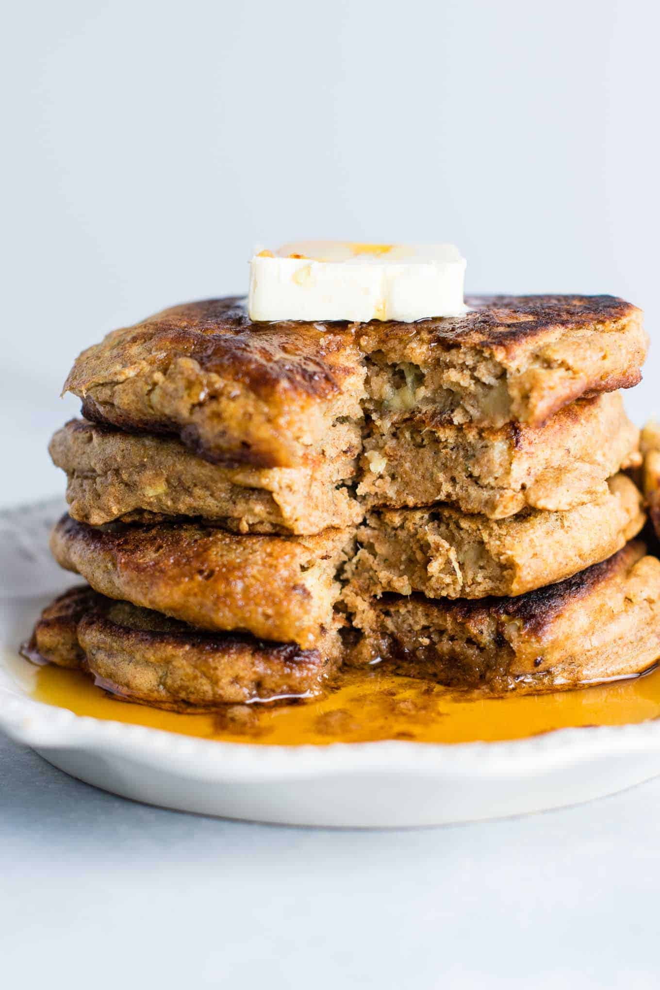 Healthy banana bread pancakes made with greek yogurt and whole wheat flour. These are amazing! #healthy #breakfast #bananabread #bananapancakes #pancakes #greekyogurt #wholewheat