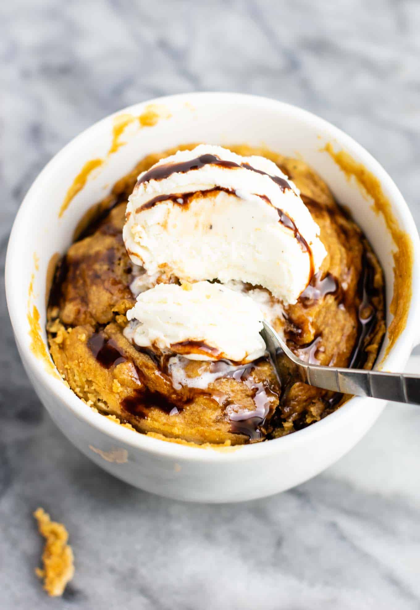 Microwave peanut butter cookie in a mug – gluten free dairy free, and refined sugar free! This tastes amazing and is so good with ice cream! #dessert #glutenfree #dairyfree #mugcake #peanutbuttercookie #peanutbuttermugcake