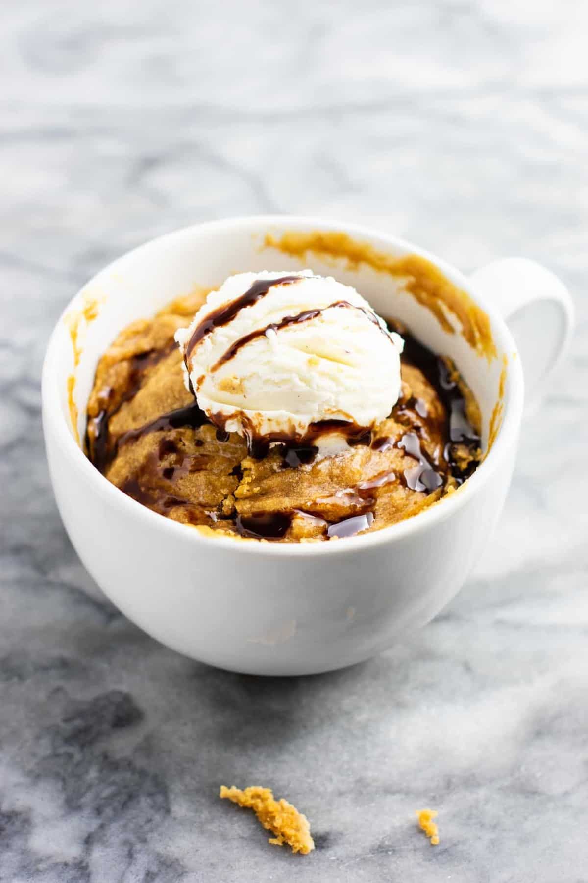 Microwave peanut butter cookie in a mug – gluten free dairy free, and refined sugar free! This tastes amazing and is so good with ice cream! #dessert #glutenfree #dairyfree #mugcake #peanutbuttercookie #peanutbuttermugcake