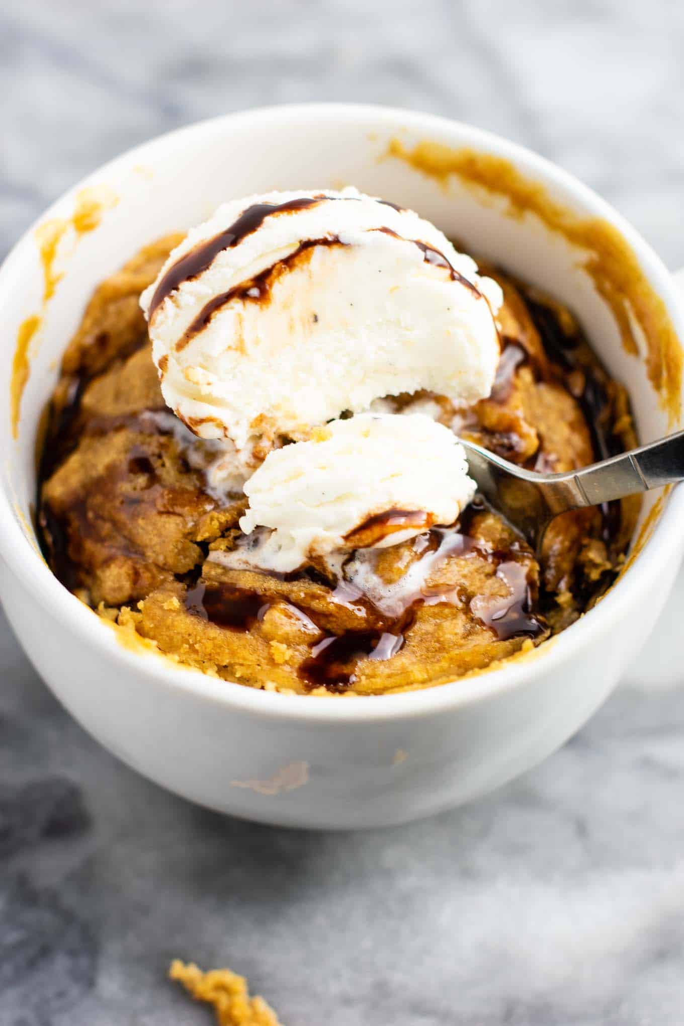 Microwave peanut butter cookie in a mug – gluten free dairy free, and refined sugar free! This tastes amazing and is so good with ice cream! #dessert #glutenfree #dairyfree #mugcake #peanutbuttercookie #peanutbuttermugcake