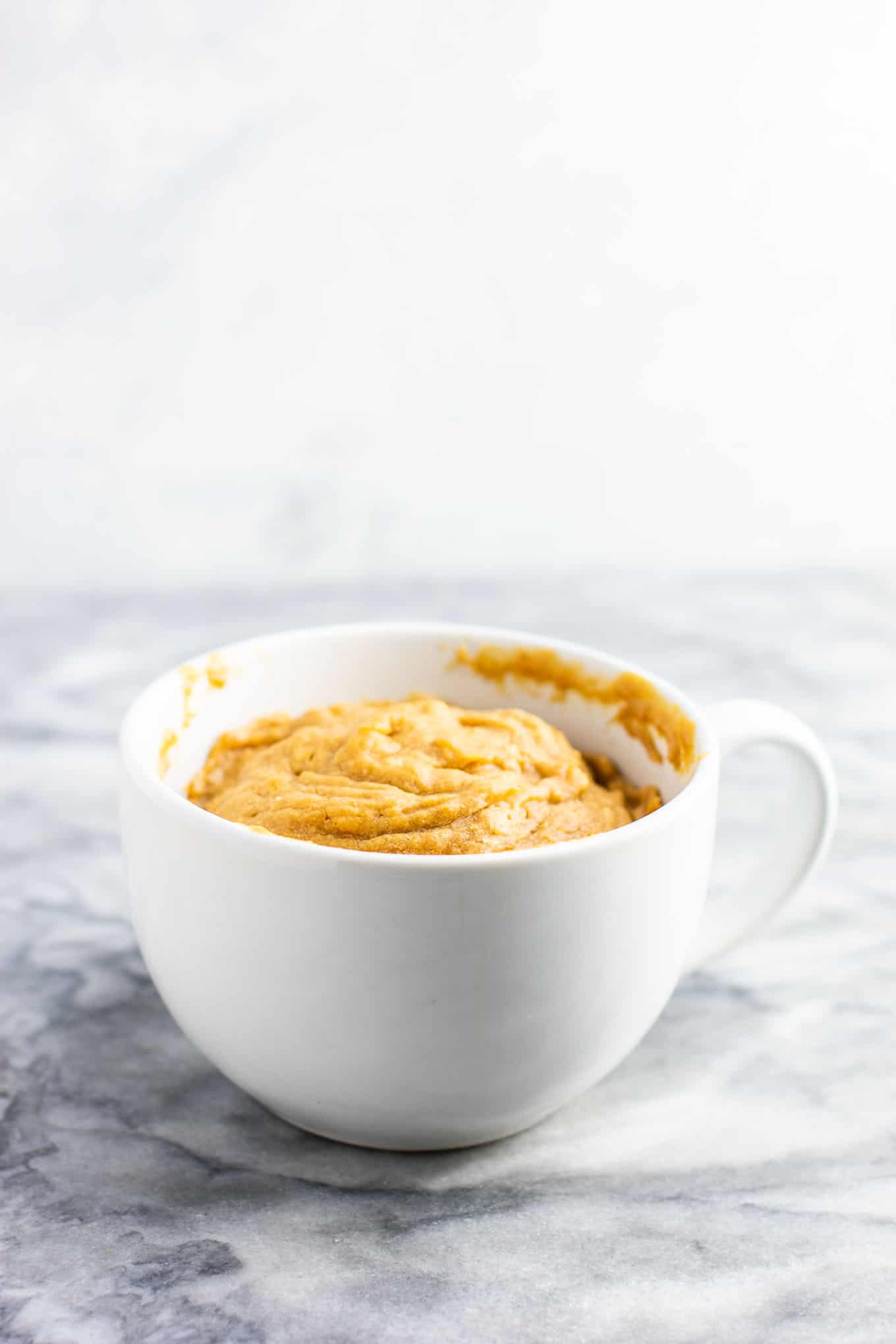 Microwave peanut butter cookie in a mug – gluten free dairy free, and refined sugar free! This tastes amazing and is so good with ice cream! #dessert #glutenfree #dairyfree #mugcake #peanutbuttercookie #peanutbuttermugcake