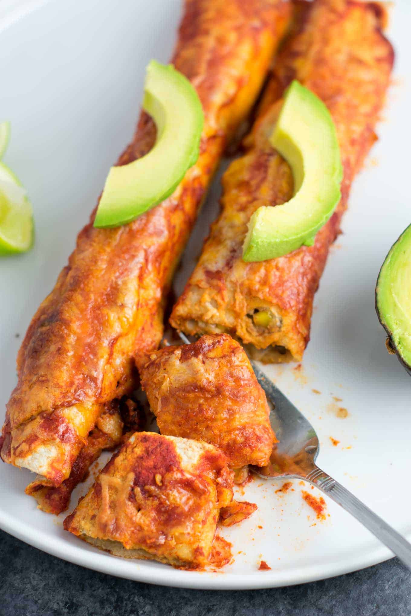 vegetarian enchiladas with avocado slices