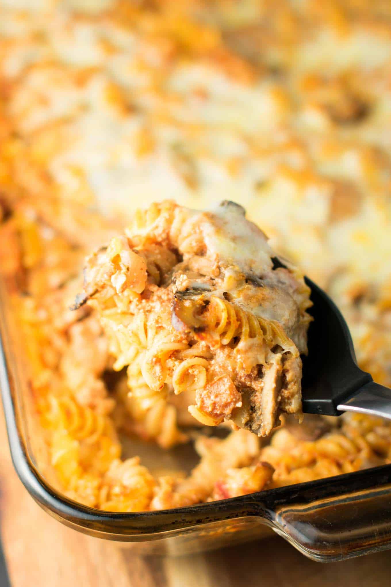 parmesan and ricotta pasta bake with a scoop being taken out