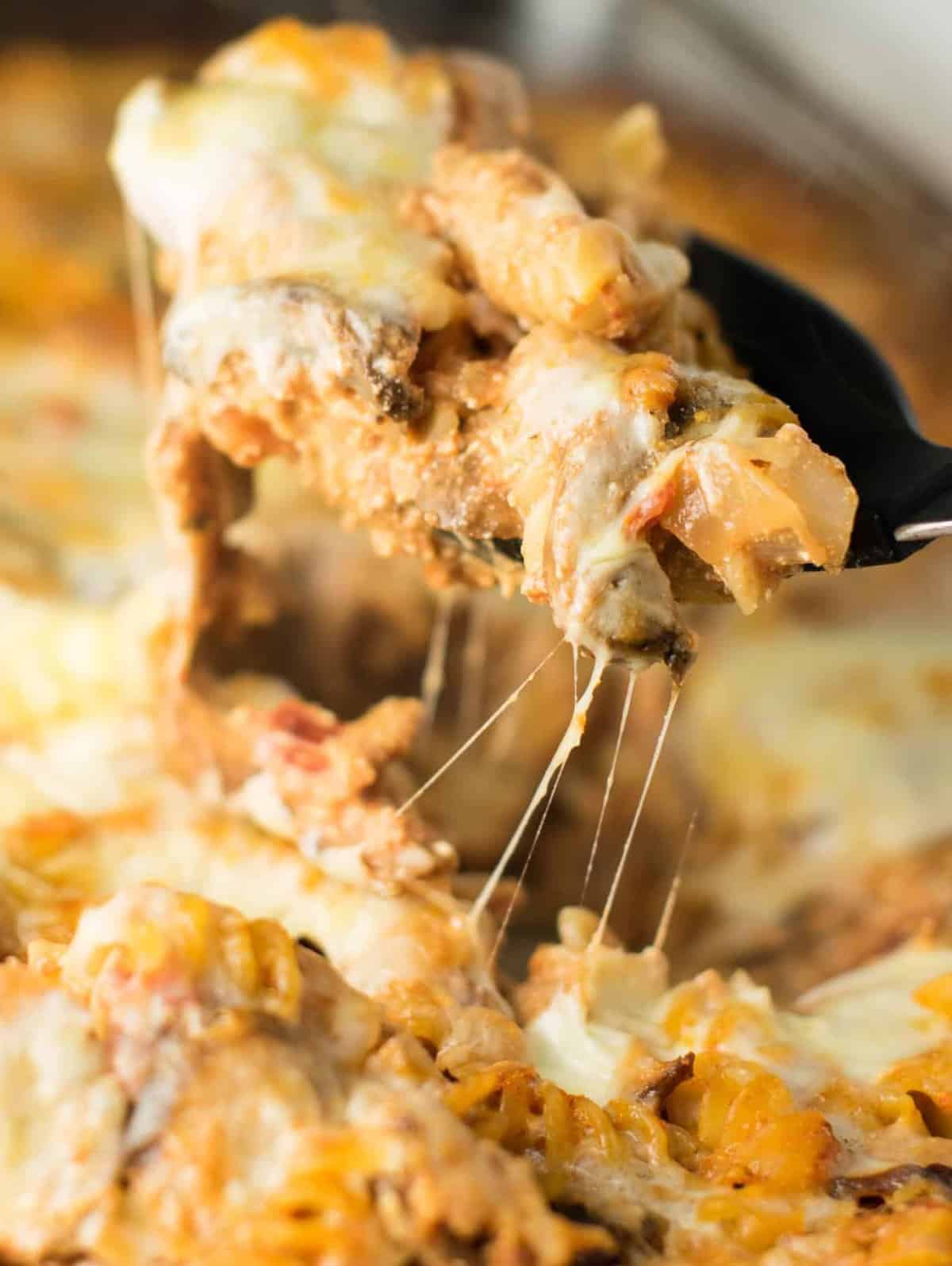 parmesan and ricotta pasta bake with a scoop being taken out