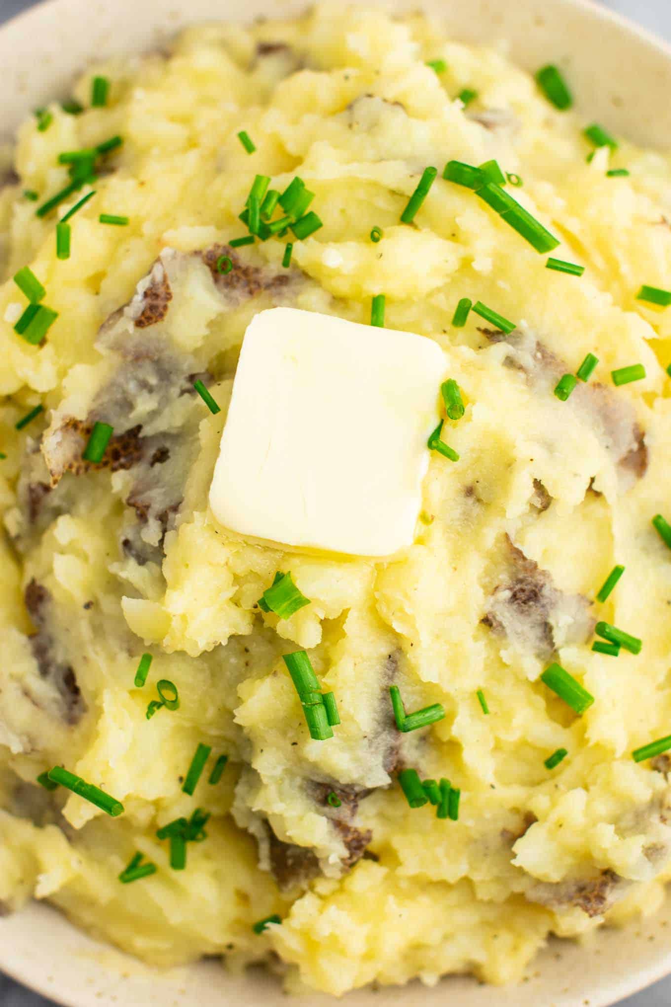 vegan mashed potatoes topped with butter and chives