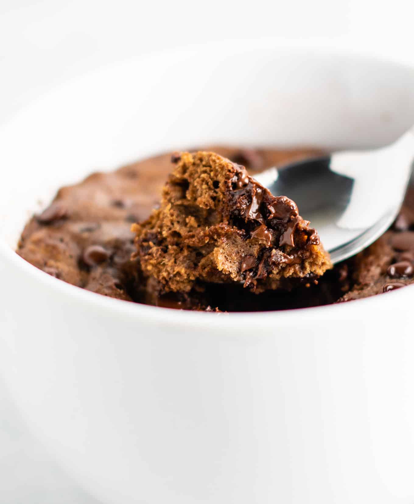 chocolate mug cake made with easy to find flours. Perfectly fluffy and so decadent - serve with ice cream!