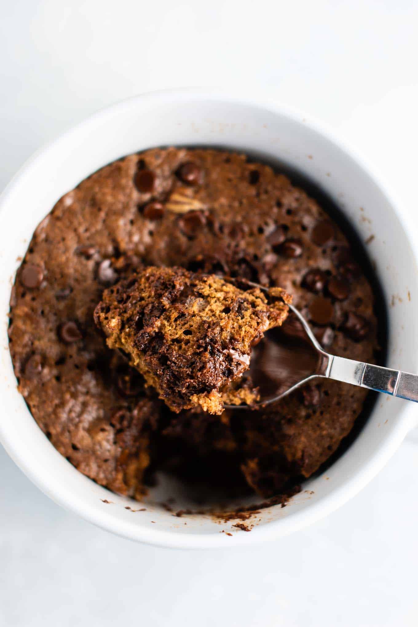 Gluten free chocolate mug cake made with easy to find flours. Perfectly fluffy and so decadent - serve with ice cream!