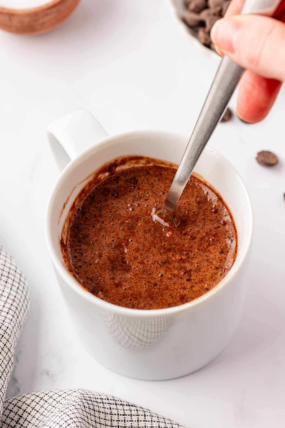 stirring the mug cake ingredients together