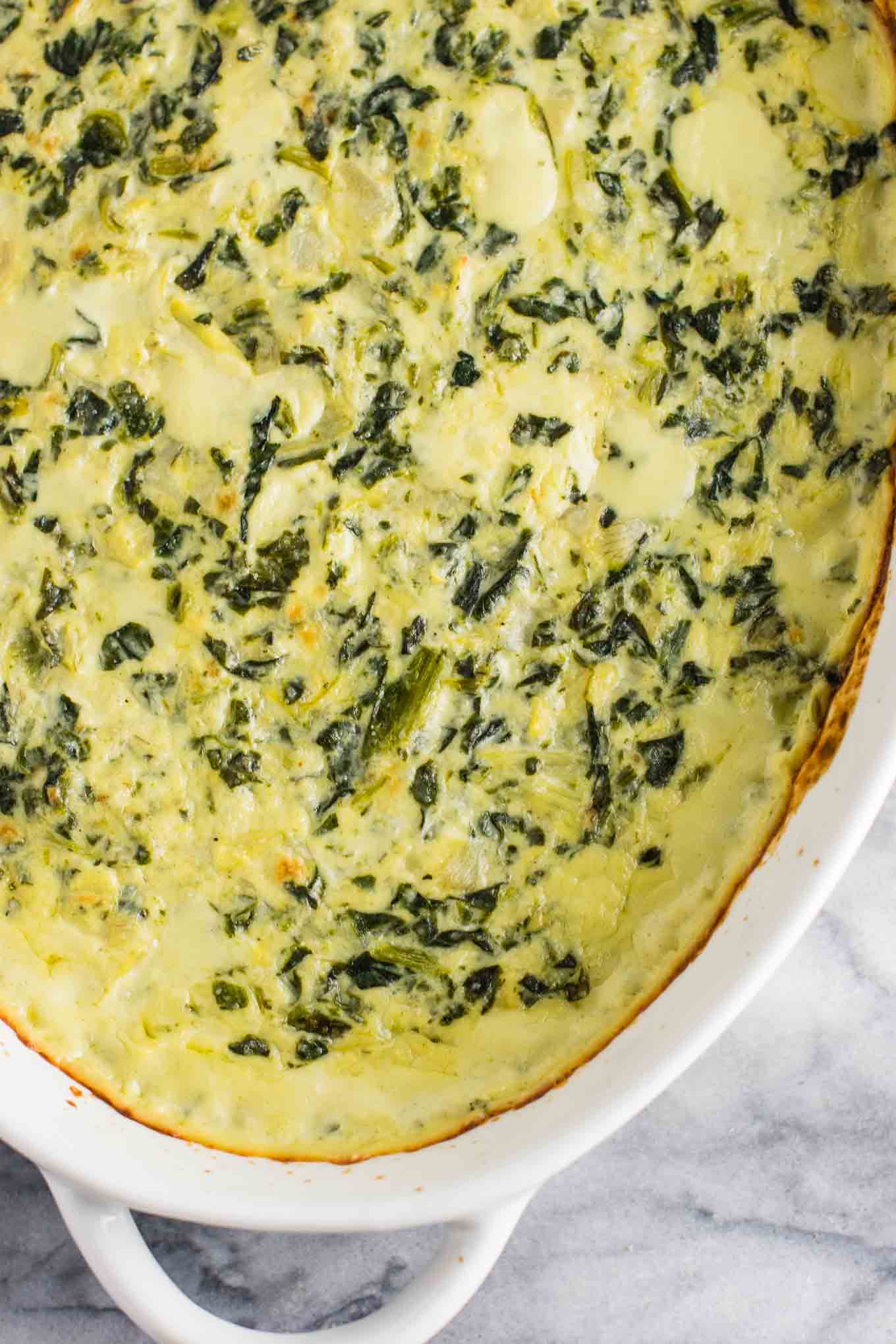 The best creamy spinach and artichoke dip recipe with Havarti and parmesan cheese. This is a hit every time I make it! #spinachartichokedip #appetizer #spinachdip #vegetarian #havarti #parmesan #dips