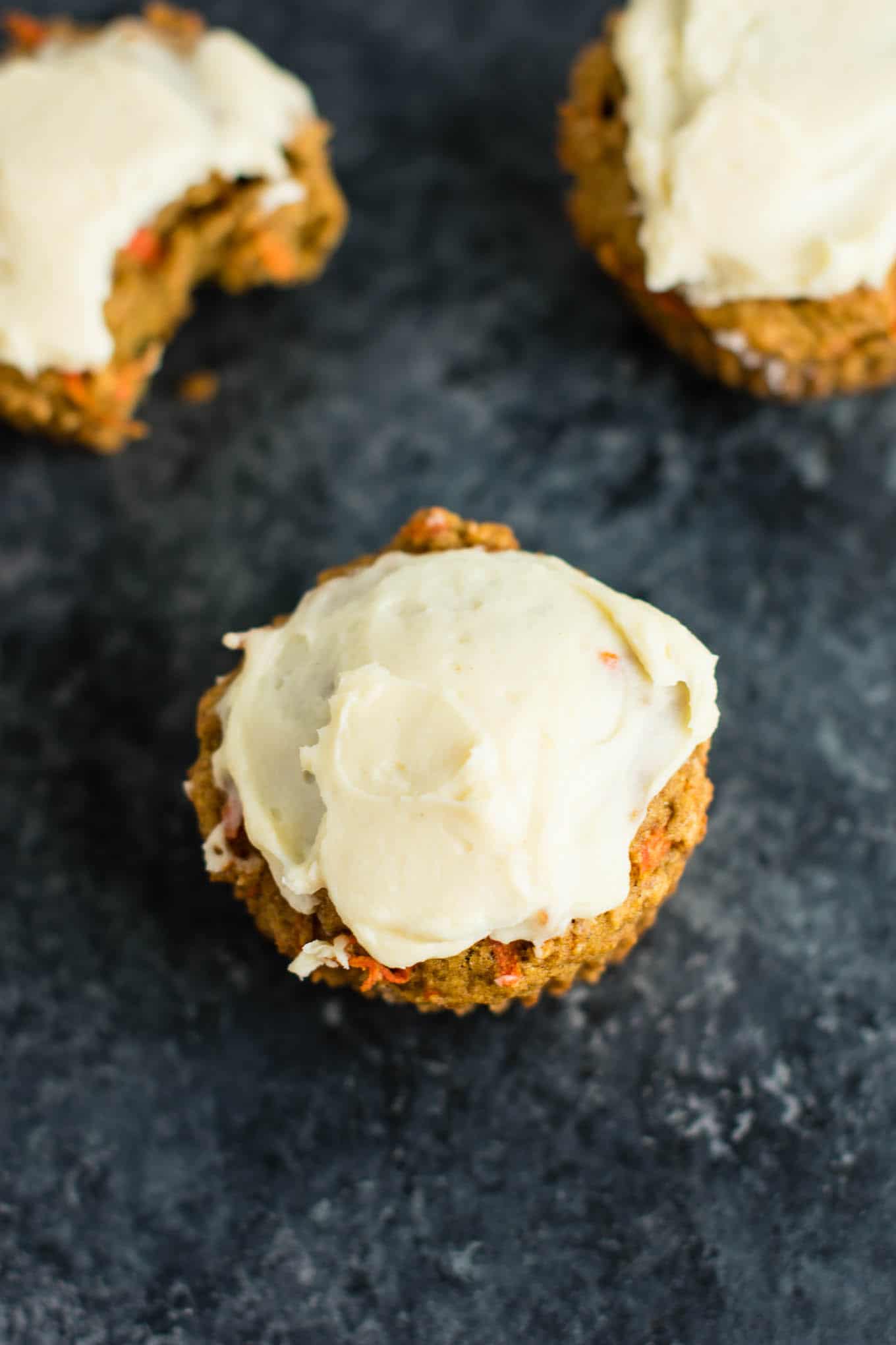 Whole wheat carrot cake muffins with cream cheese frosting - basically feel like I'm eating dessert for breakfast! #muffins #carrotcakemuffins #carrotcake #wholewheat #creamcheesefrosting #breakfast #vegetarian