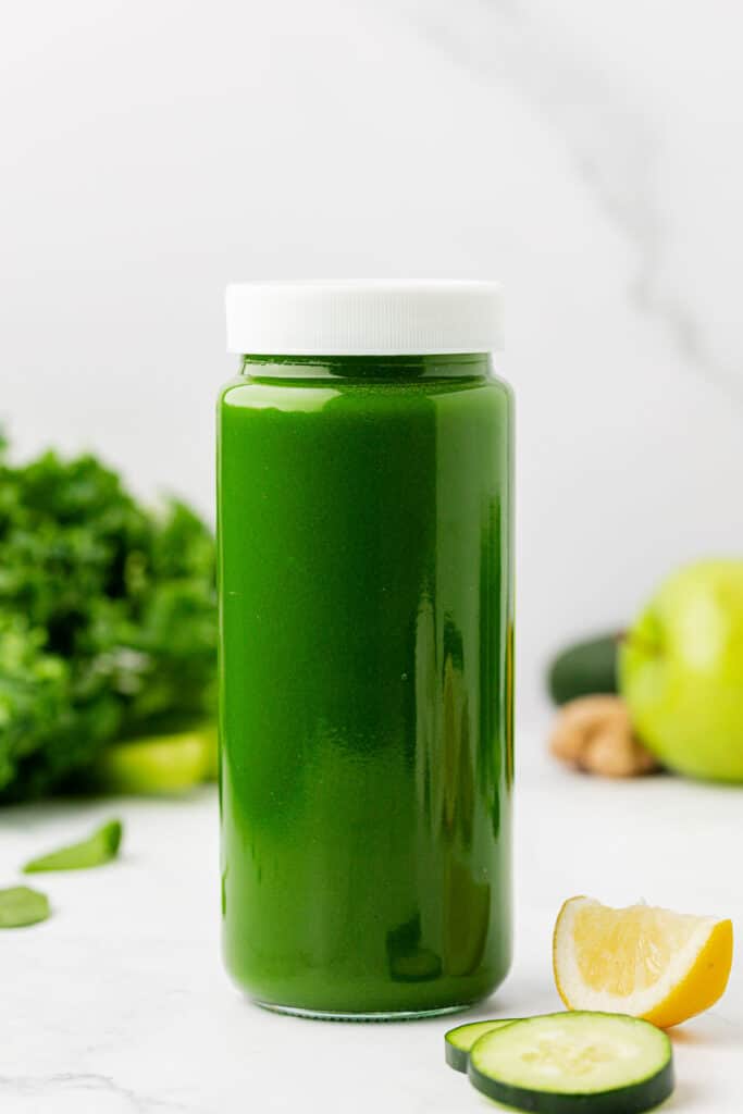 green juice in a jar with a lid
