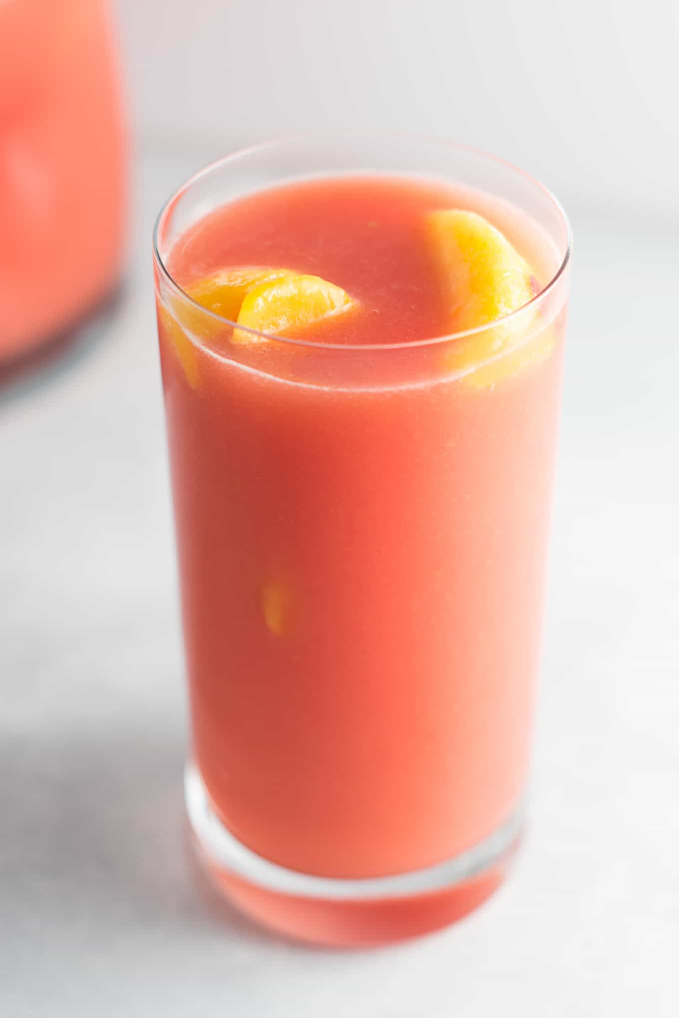 Fresh raspberry peach lemonade recipe made with lemons, raspberries, peaches, water, and maple syrup. Naturally sweetened and delicious!