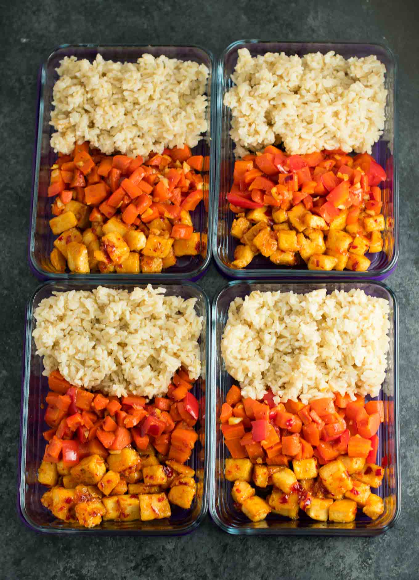 Meal Prep Sweet Chili Tofu Bowls with brown rice and vegetables. A delicious vegan or vegetarian meal! #vegan #vegetarian #veganmealprep #tofu