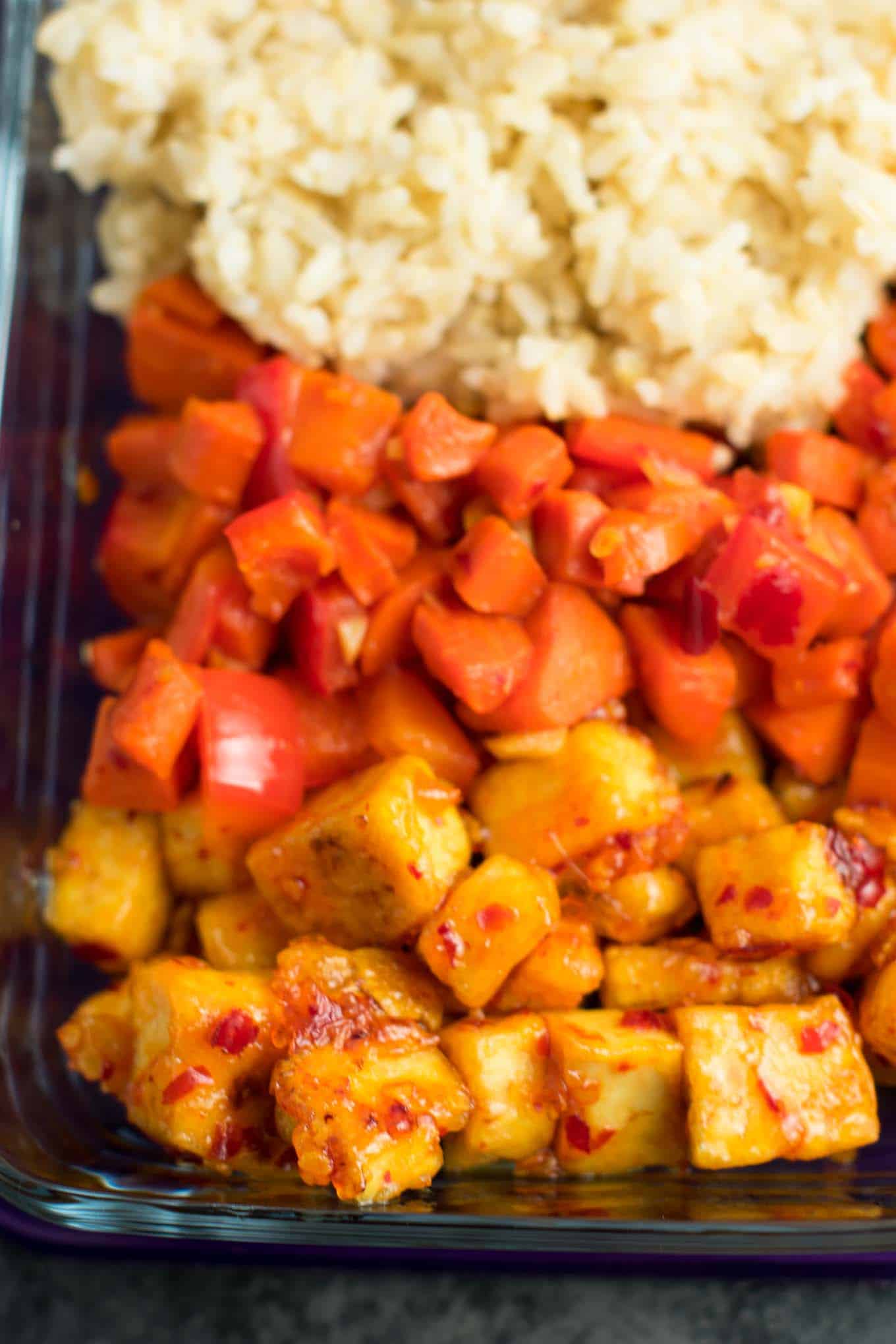 Meal Prep Sweet Chili Tofu Bowls with brown rice and vegetables. A delicious vegan or vegetarian meal! #vegan #vegetarian #veganmealprep #tofu