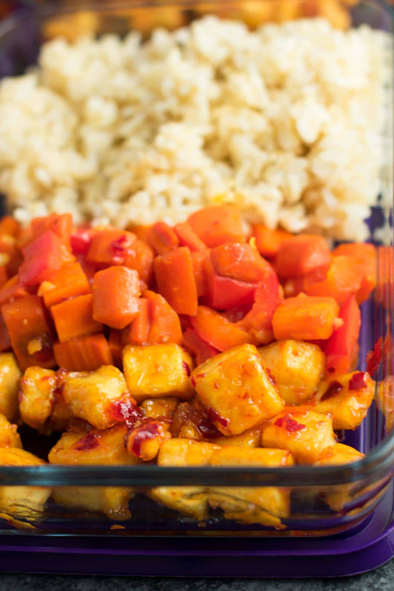 Meal Prep Sweet Chili Tofu Bowls with brown rice and vegetables. A delicious vegan or vegetarian meal! #vegan #vegetarian #veganmealprep #tofu