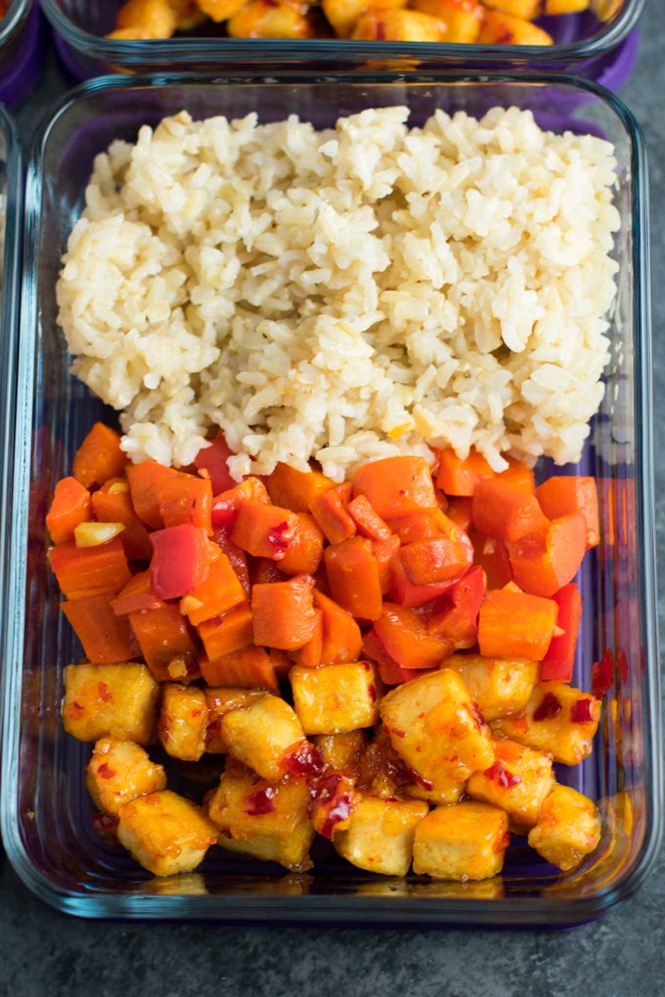 Meal Prep Sweet Chili Tofu Bowls with brown rice and vegetables. A delicious vegan or vegetarian meal! #vegan #vegetarian #veganmealprep #tofu