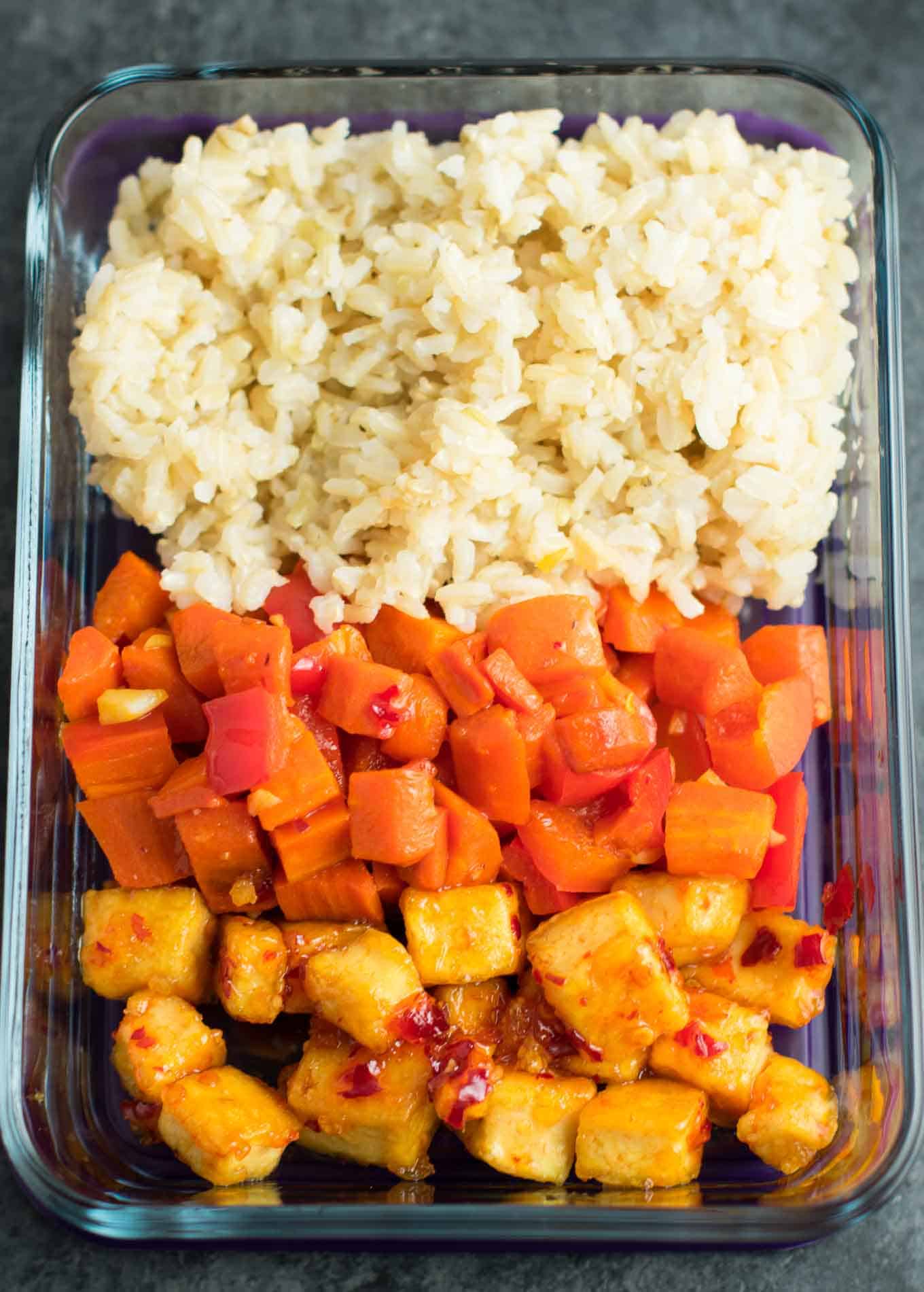 Meal Prep Sweet Chili Tofu Bowls with brown rice and vegetables. A delicious vegan or vegetarian meal! #vegan #vegetarian #veganmealprep #tofu