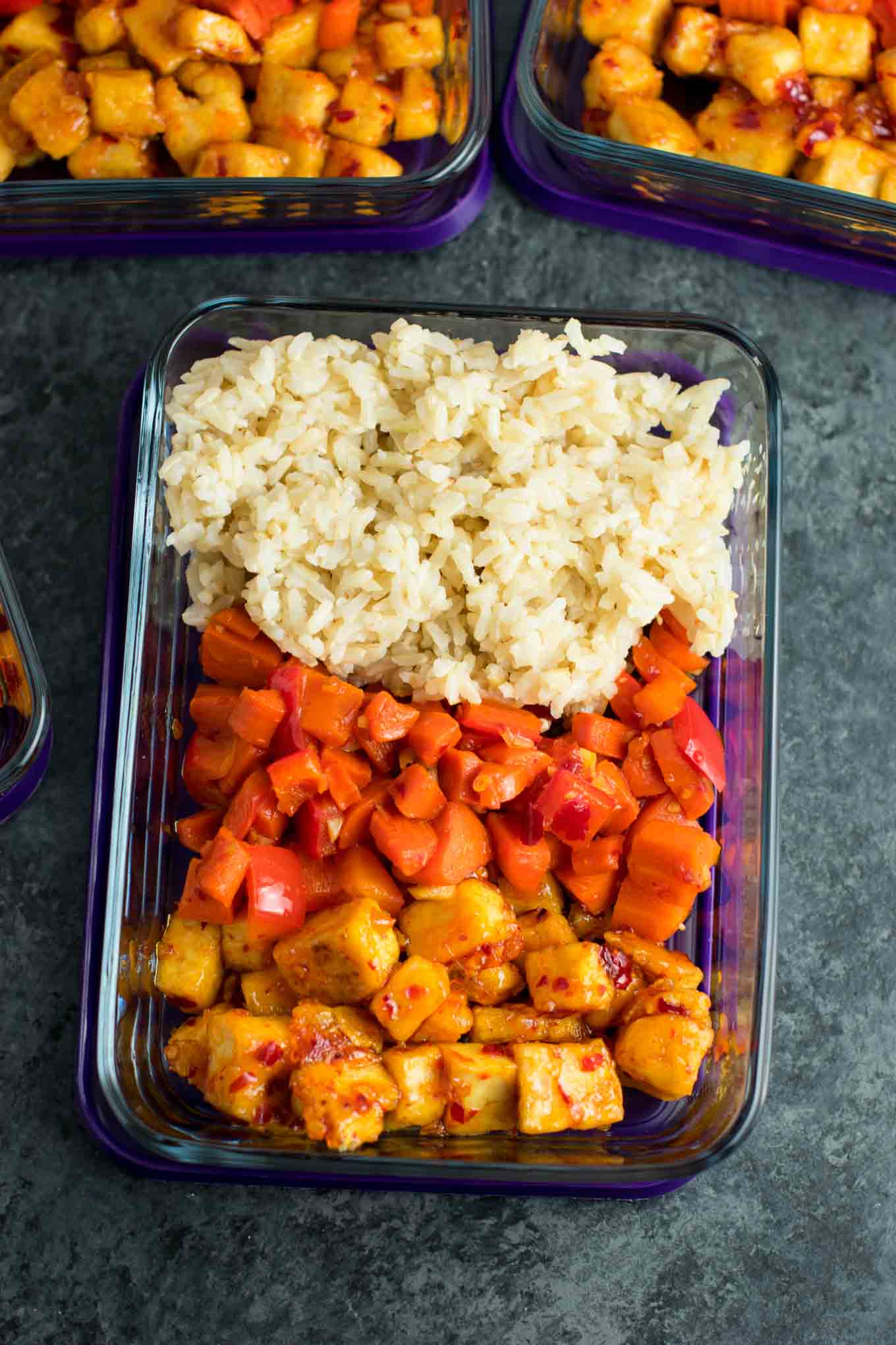 Meal Prep Sweet Chili Tofu Bowls with brown rice and vegetables. A delicious vegan or vegetarian meal! #vegan #vegetarian #veganmealprep #tofu