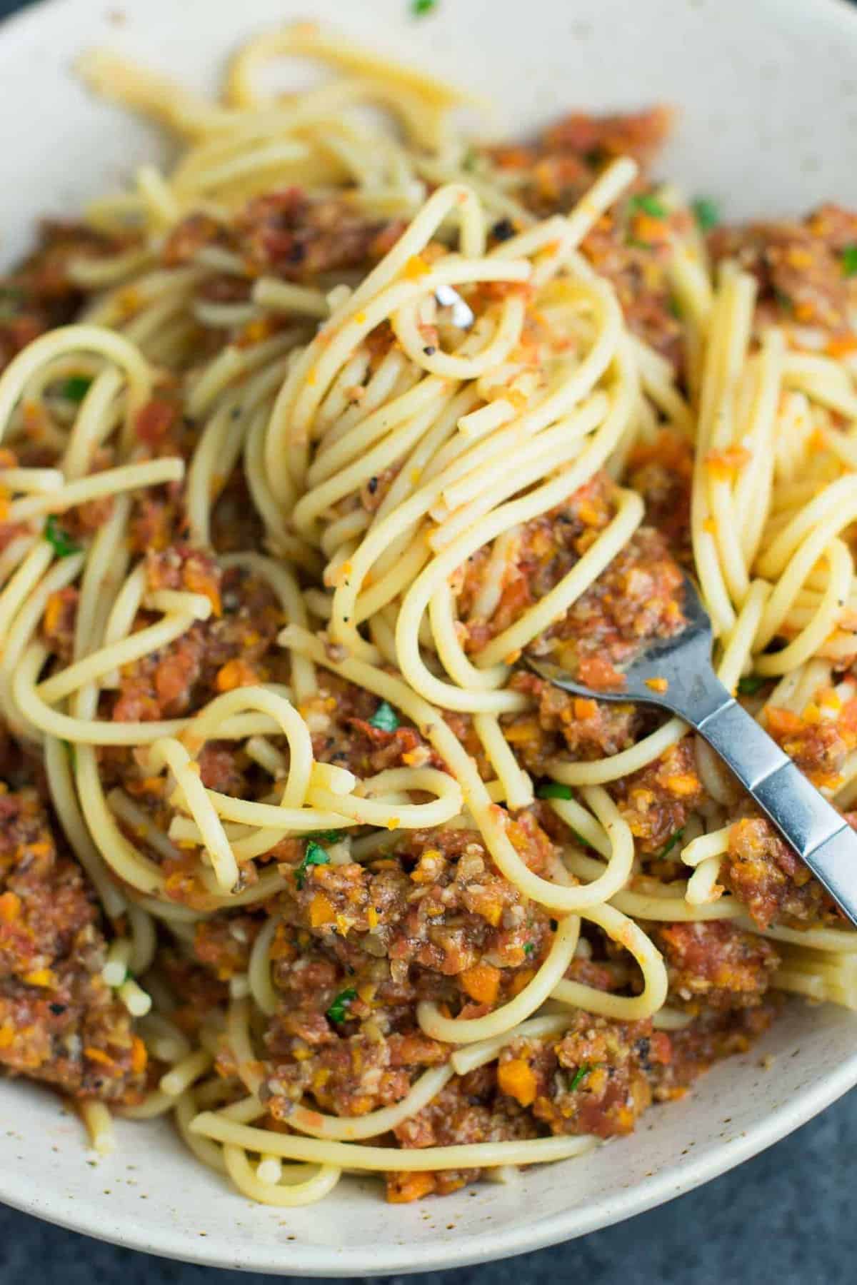 Vegetable bolognese recipe made with mushrooms, carrots, celery, garlic, and onion. A delicious meatless vegetarian "meat" sauce recipe. #vegetablebolognese #vegan #vegetarian #bologneserecipe