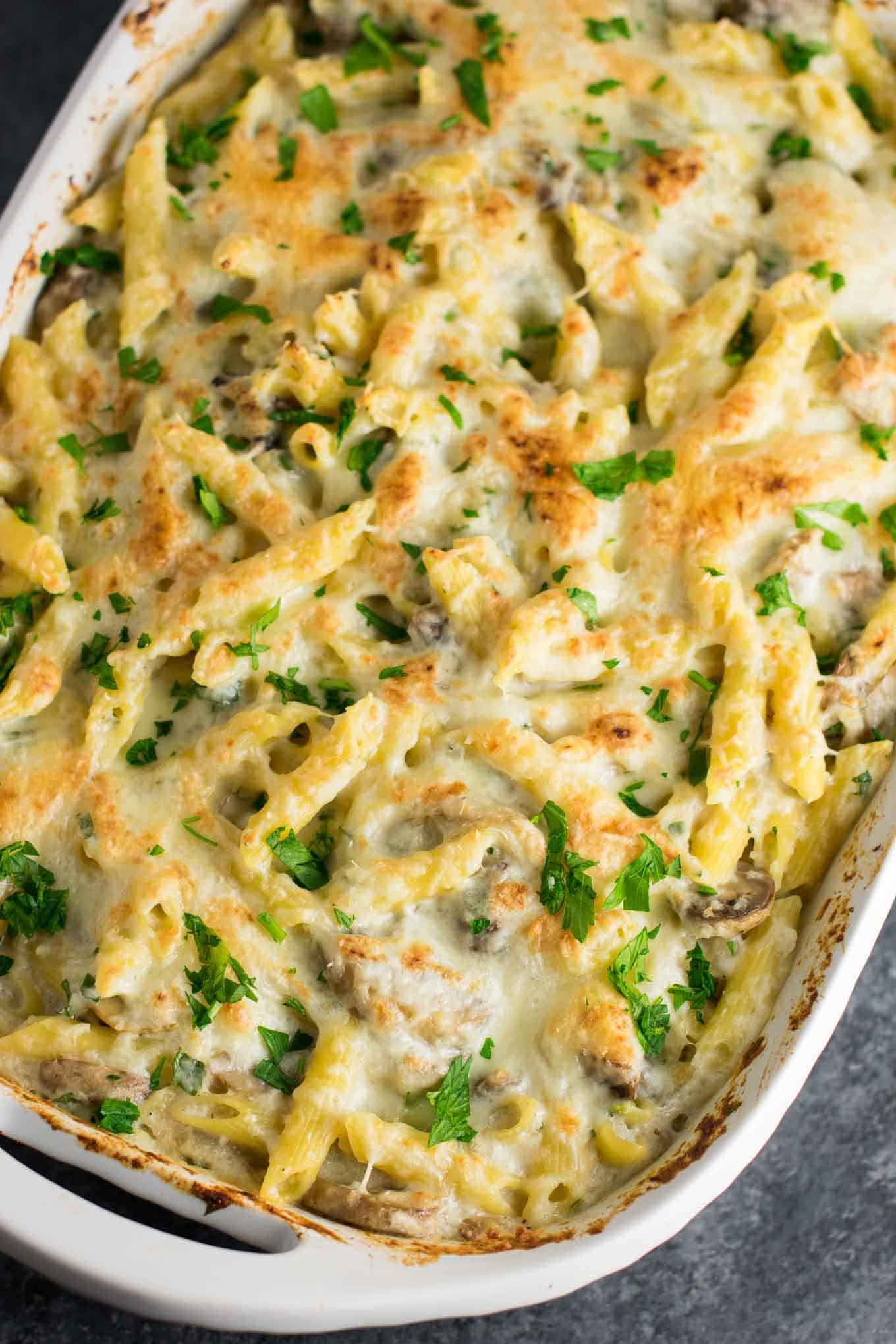 Mushroom cauliflower alfredo pasta bake recipe. A deliciously indulgent pasta bake lightened up with a homemade creamy cauliflower sauce. #caulifloweralfredo #vegetarian #pasta #dinner