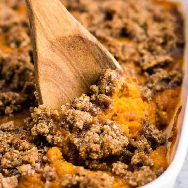 Gluten free sweet potato casserole with pecan crumble. This tastes incredible and everyone loves it! #sweetpotatocasserole #thanksgiving #pecans #glutenfree #vegetarian