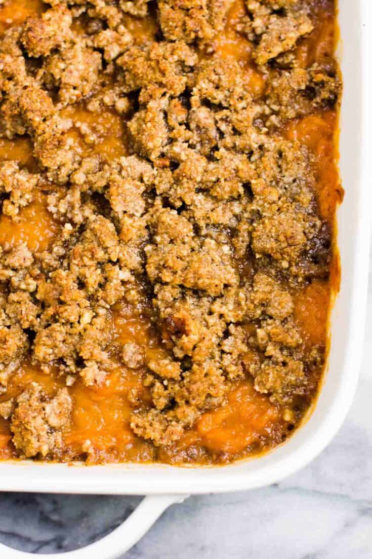 Gluten free sweet potato casserole with pecan crumble. This tastes incredible and everyone loves it! #sweetpotatocasserole #thanksgiving #pecans #glutenfree #vegetarian