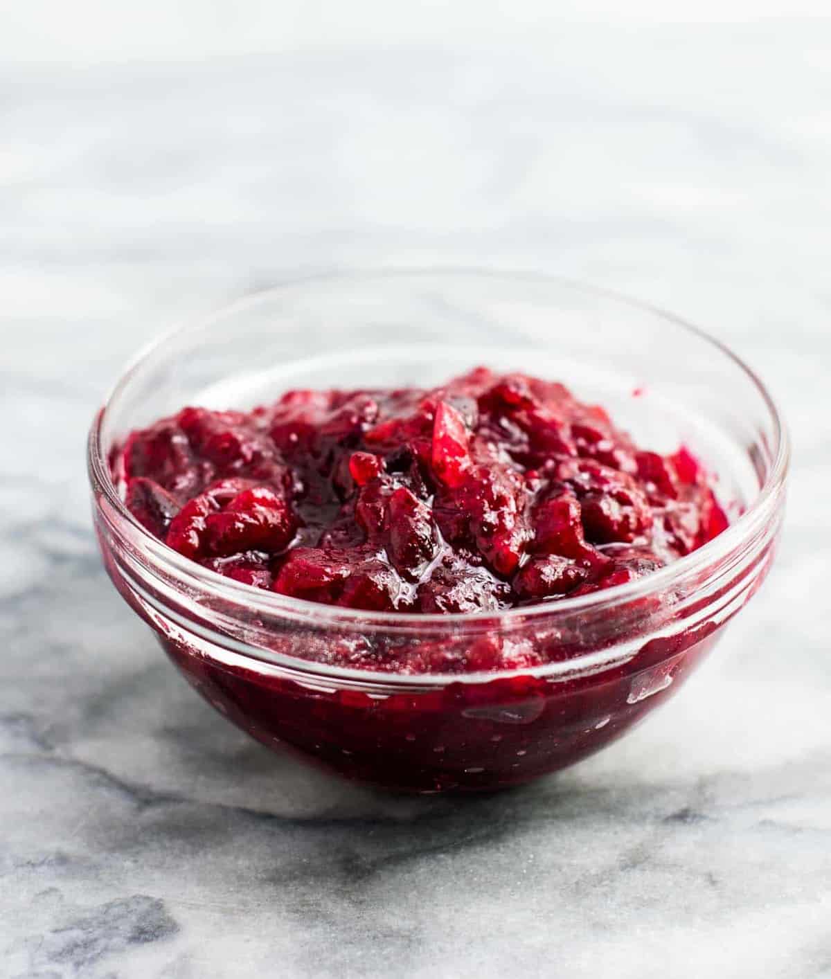 vegetarian thanksgiving menu - Healthy cranberry sauce recipe (vegan). Only 3 ingredients and low sugar. The best cranberry sauce I have ever had! We make this every year. #cranberrysauce #thanksgiving #vegan #vegetarian #healthycranberrysauce #freshcranberries