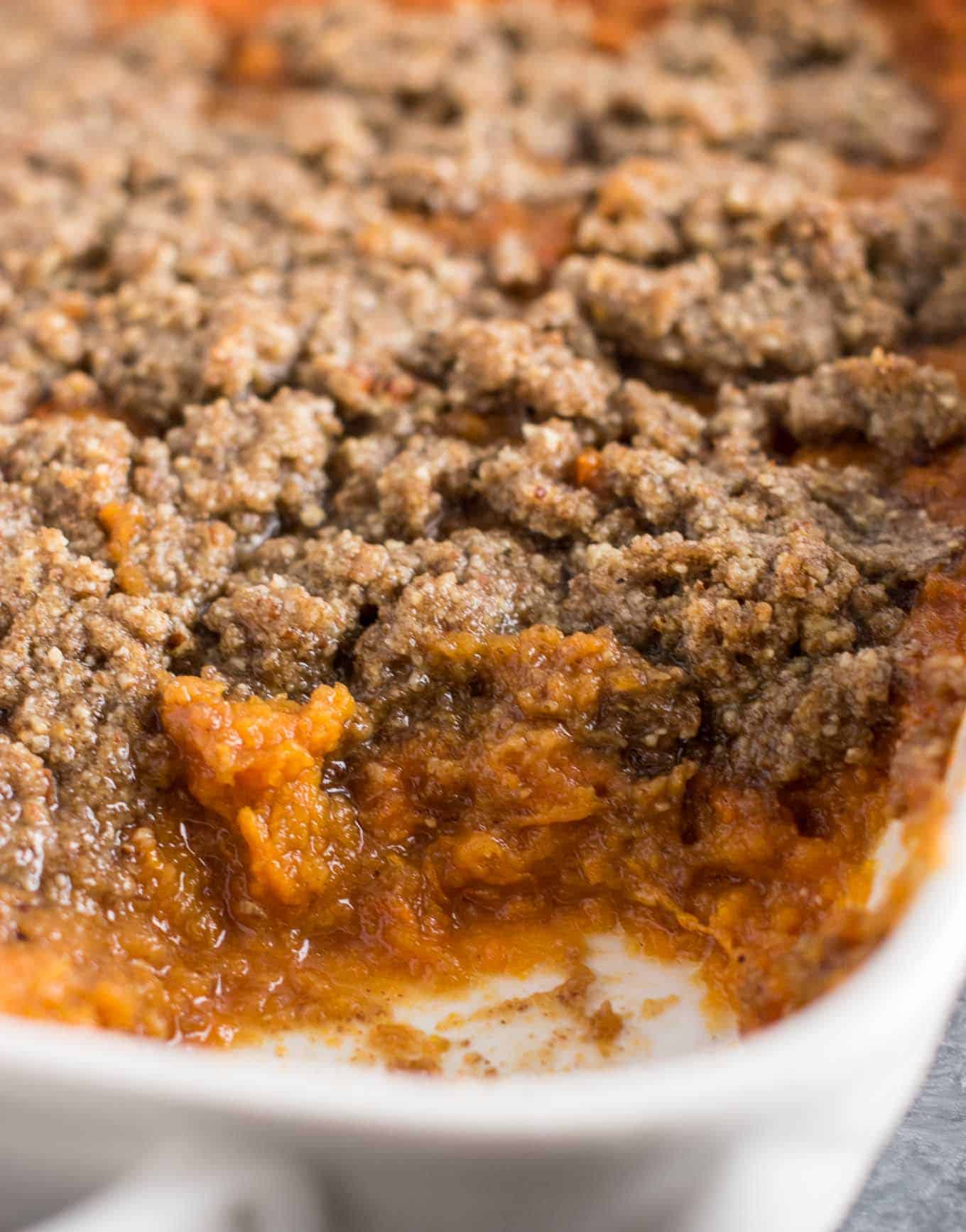 This sweet potato casserole with pecan crumble is the BEST side for your Thanksgiving table! Melt in your mouth buttery sweet potatoes are topped with a salty sweet gluten free pecan crumble. You will be fighting for seconds! #thanksgiving #sweetpotatocasserole #vegetarian #glutenfree