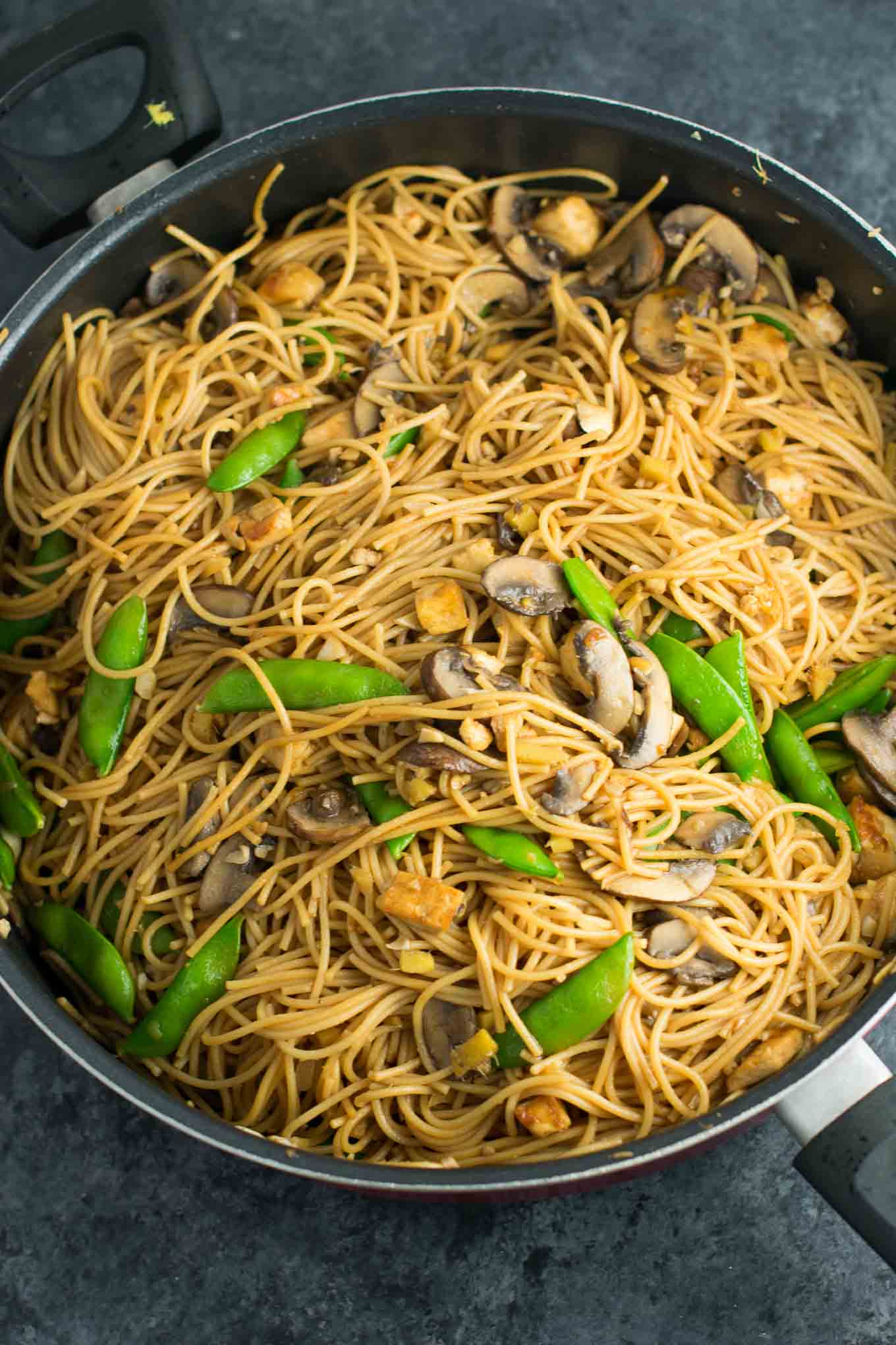 Easy Tofu Lo Mein recipe with fresh vegetables and a simple sauce. Ready in minutes and packed full of protein! #tofu #lomein #vegan #vegetarian