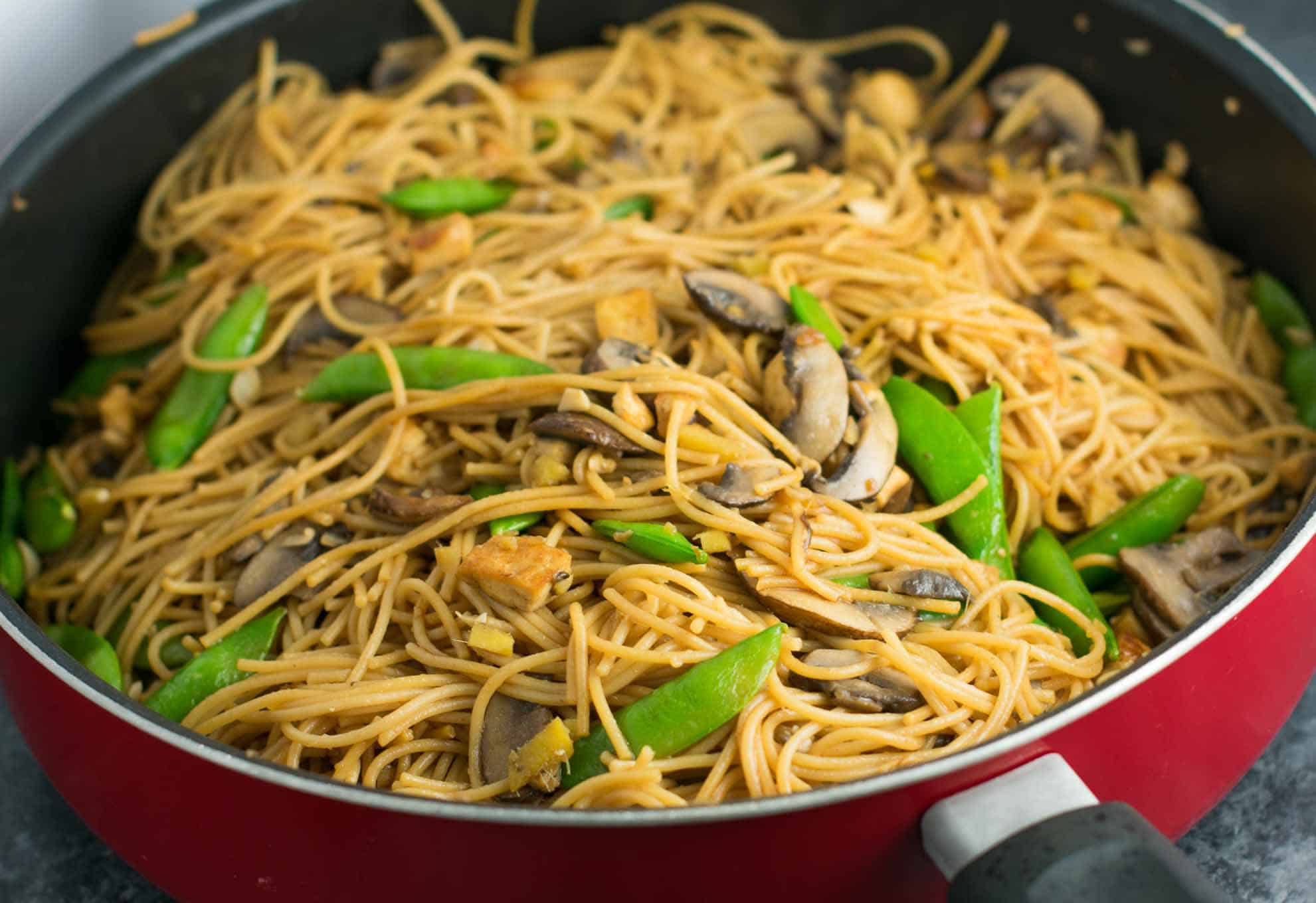 Easy Tofu Lo Mein recipe with fresh vegetables and a simple sauce. Ready in minutes and packed full of protein! #tofu #lomein #vegan #vegetarian