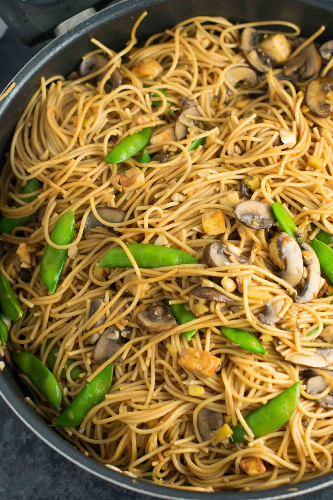 Easy Tofu Lo Mein recipe with fresh vegetables and a simple sauce. Ready in minutes and packed full of protein! #tofu #lomein #vegan #vegetarian