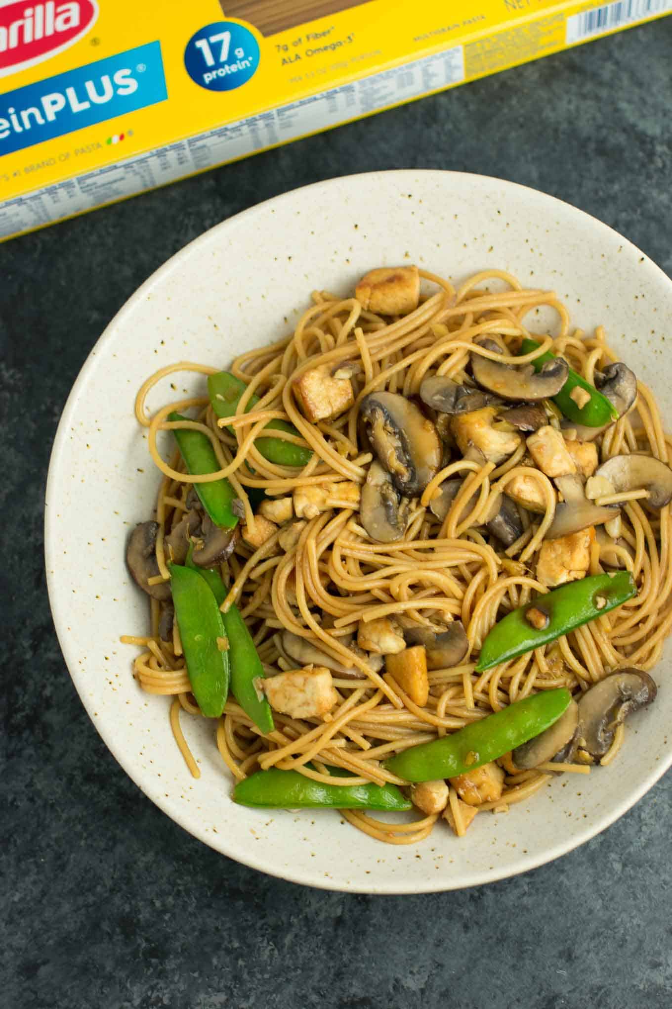 Easy Tofu Lo Mein recipe with fresh vegetables and a simple sauce. Ready in minutes and packed full of protein! #tofu #lomein #vegan #vegetarian