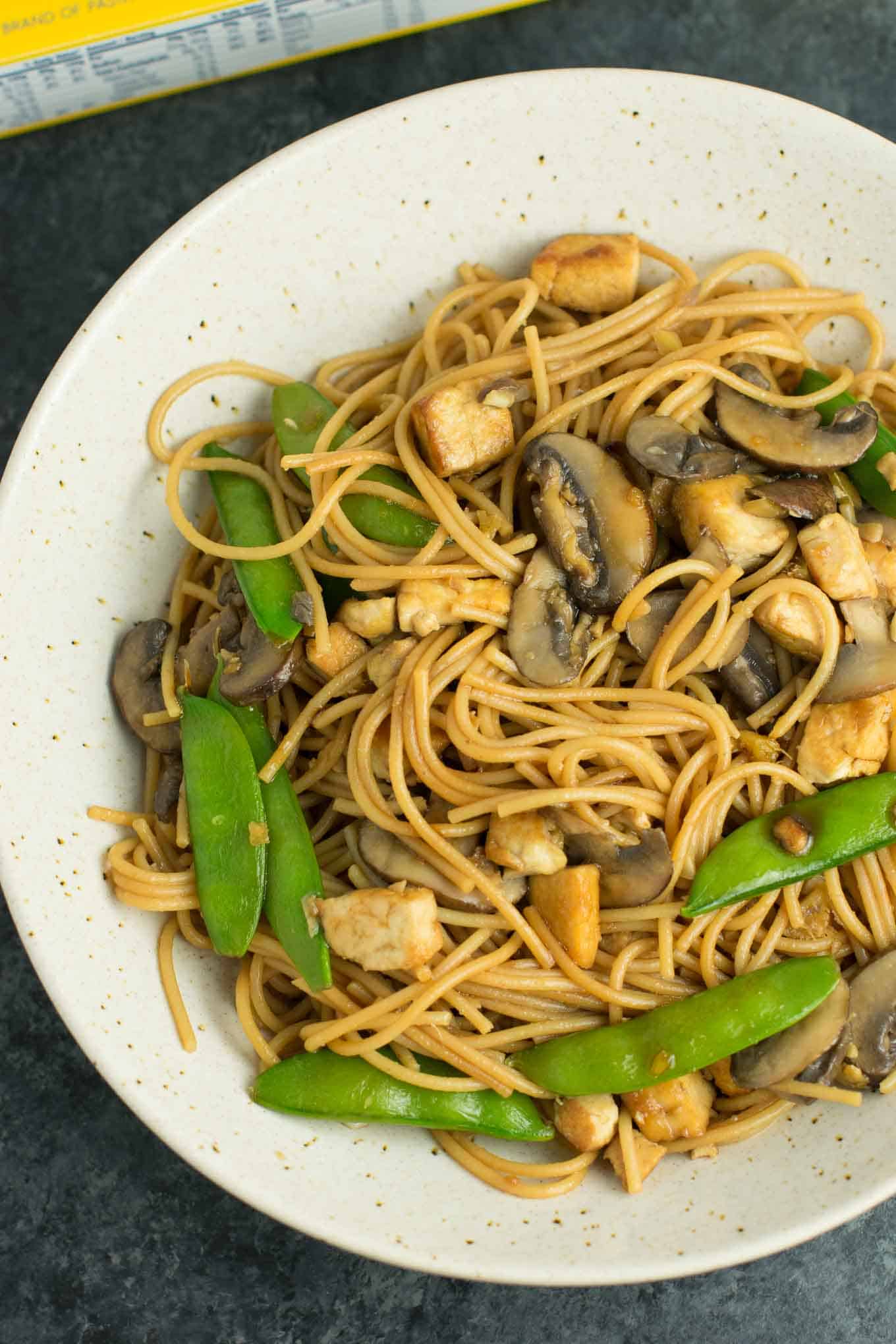 Easy Tofu Lo Mein recipe with fresh vegetables and a simple sauce. Ready in minutes and packed full of protein! #tofu #lomein #vegan #vegetarian