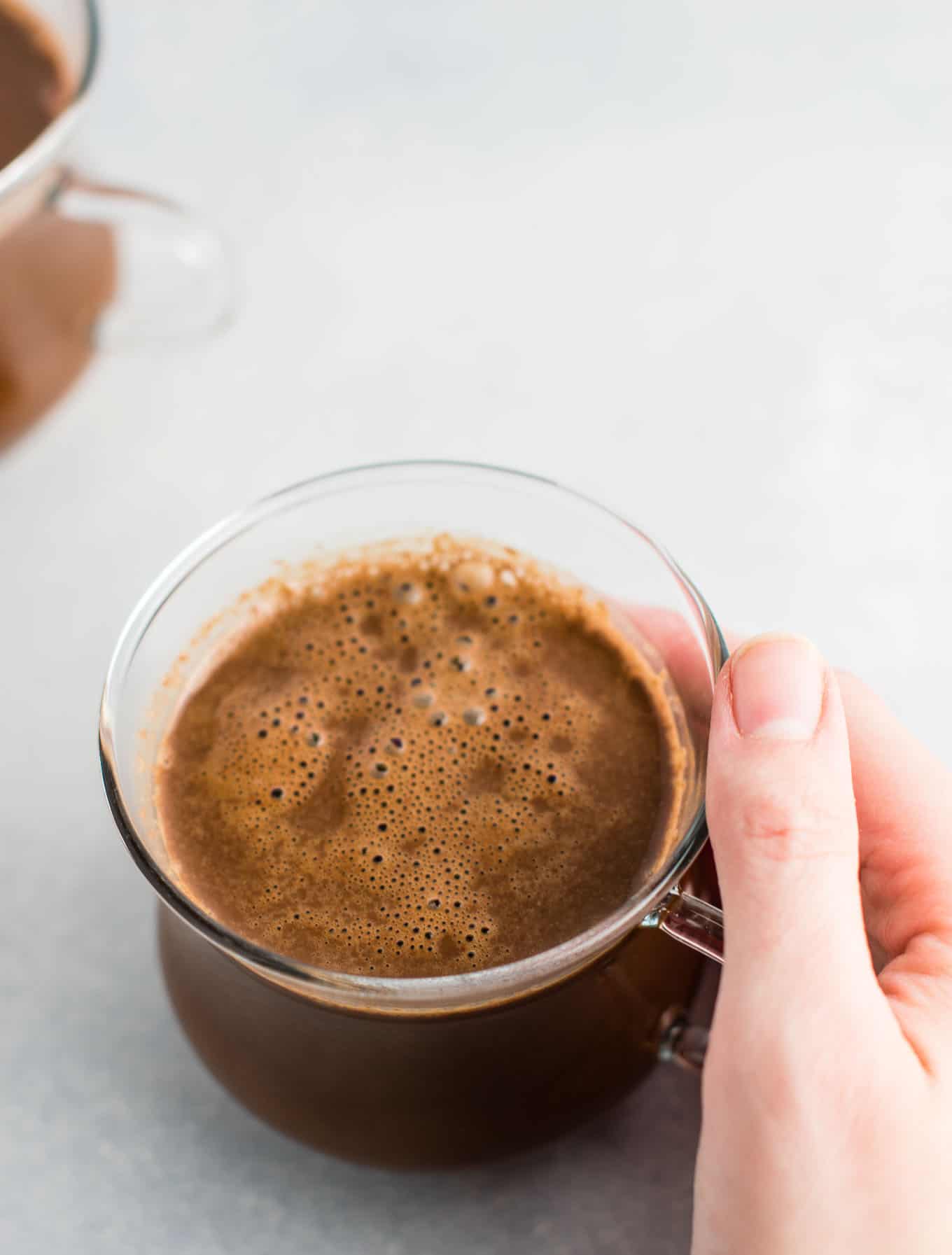 Easy 4 Ingredient vegan hot chocolate recipe made with almond milk. Dairy free, gluten free, and vegan. The perfect cozy winter drink! #vegan #hotchocolate #drinks #christmas #dairyfree 