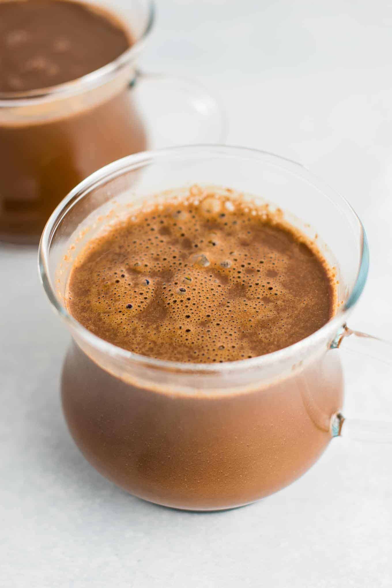 Easy 4 Ingredient vegan hot chocolate recipe made with almond milk. Dairy free, gluten free, and vegan. The perfect cozy winter drink! #vegan #hotchocolate #drinks #christmas #dairyfree 