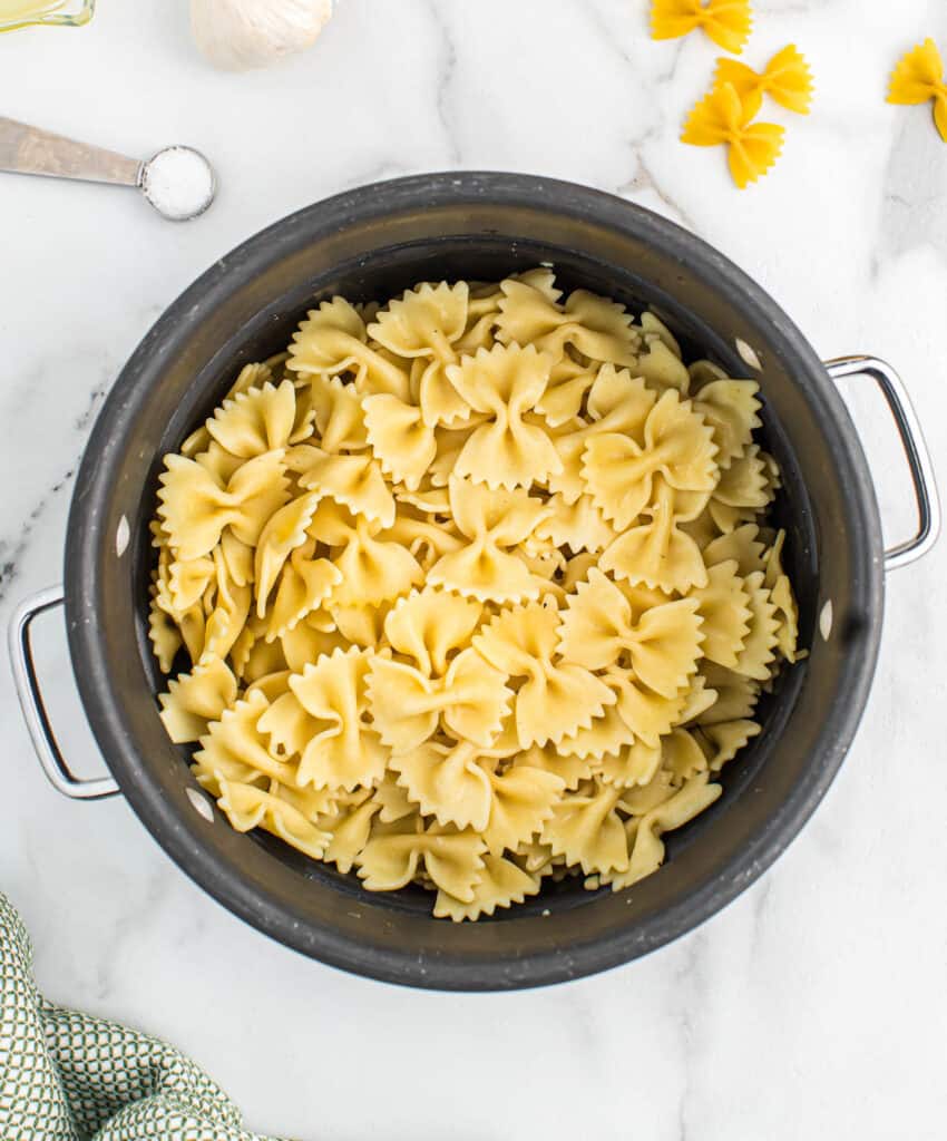 cooked bowtie pasta in a pan