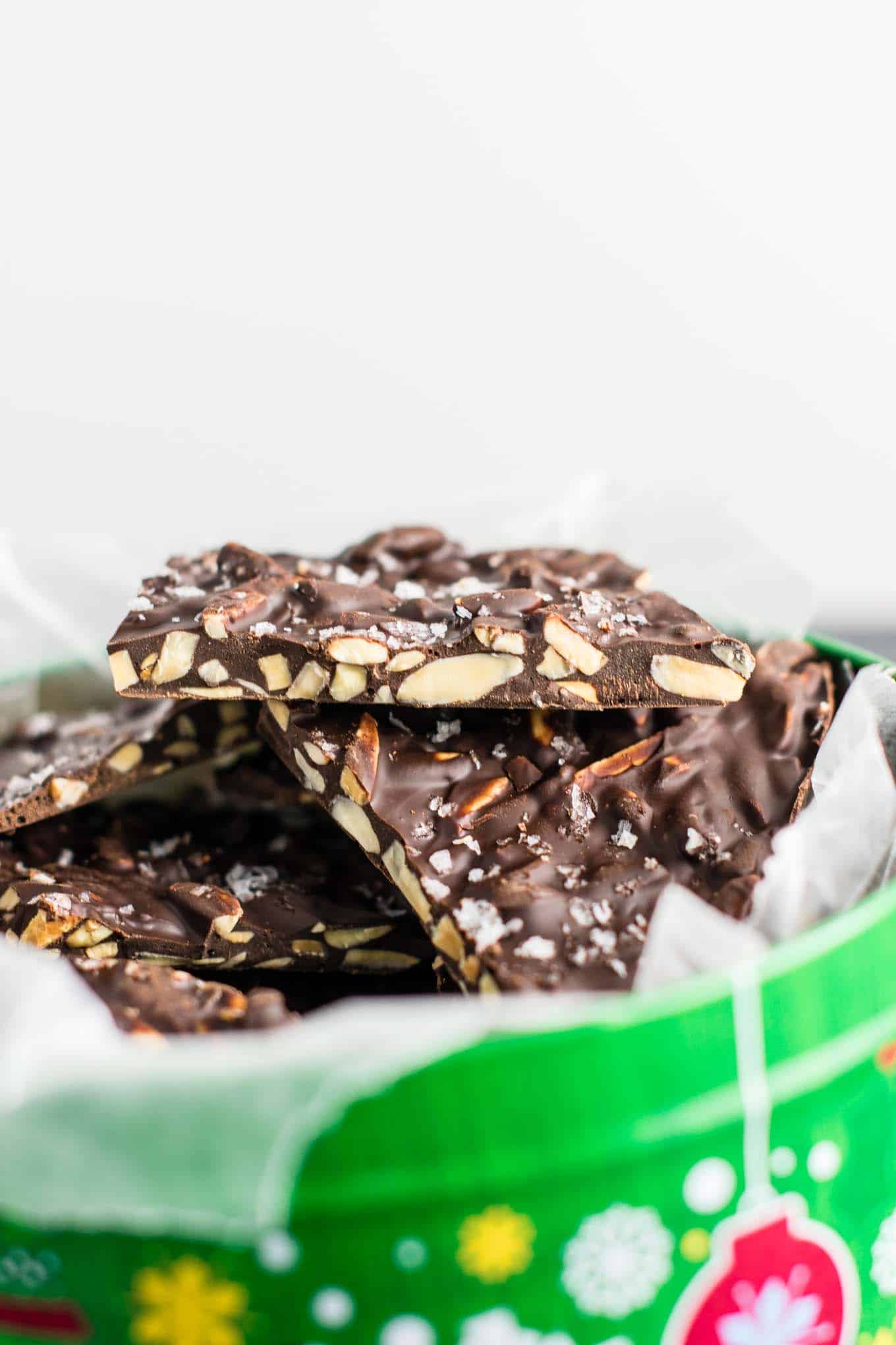 a piece of chocolate almond bark showing the inside texture