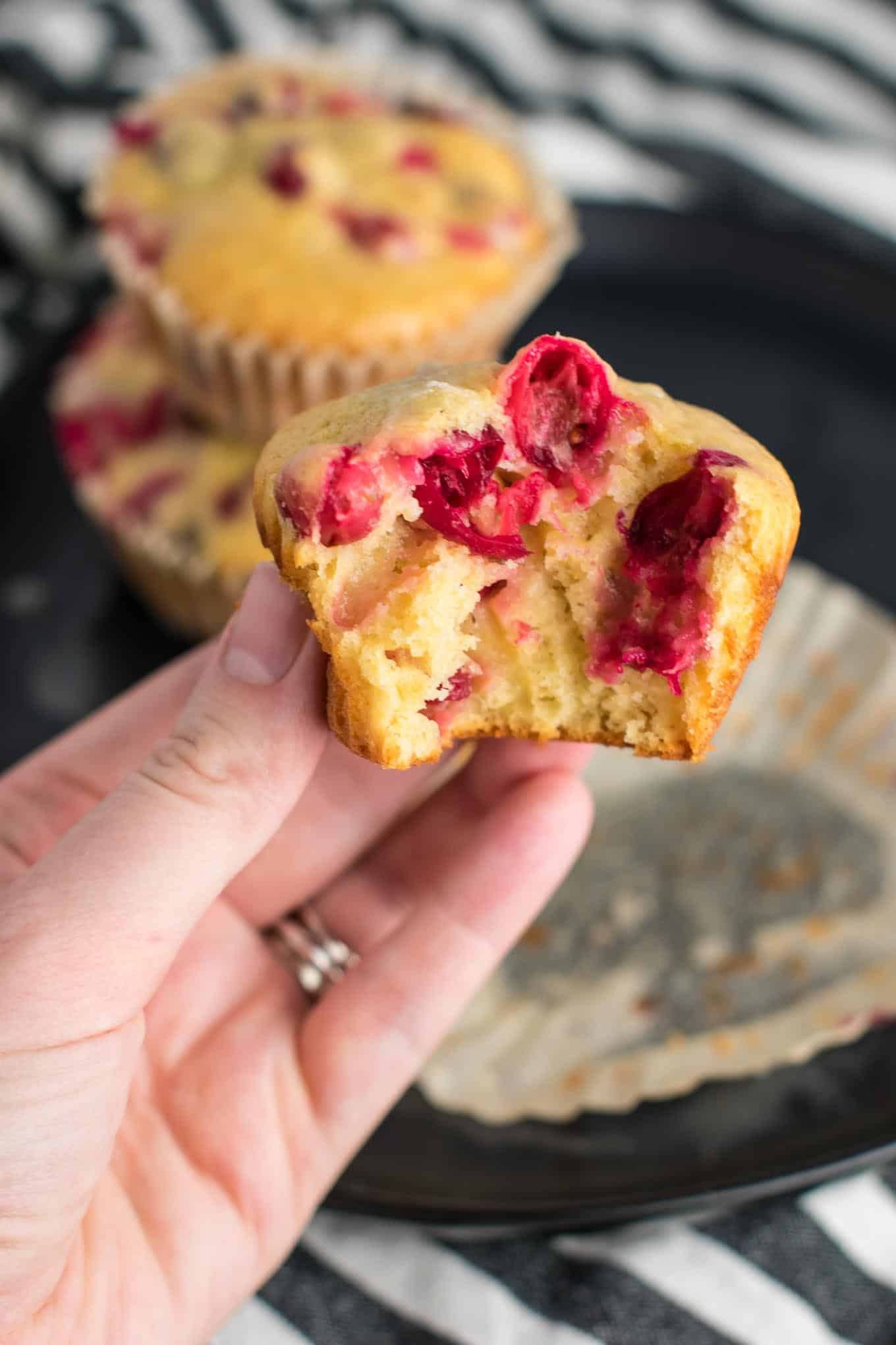 Healthy Cranberry Orange Muffins recipe made with greek yogurt and whole wheat pastry flour with a sweet orange glze. A healthier holiday breakfast or dessert! #breakfast #cranberry #muffins #cranberryorangemuffins #healthy