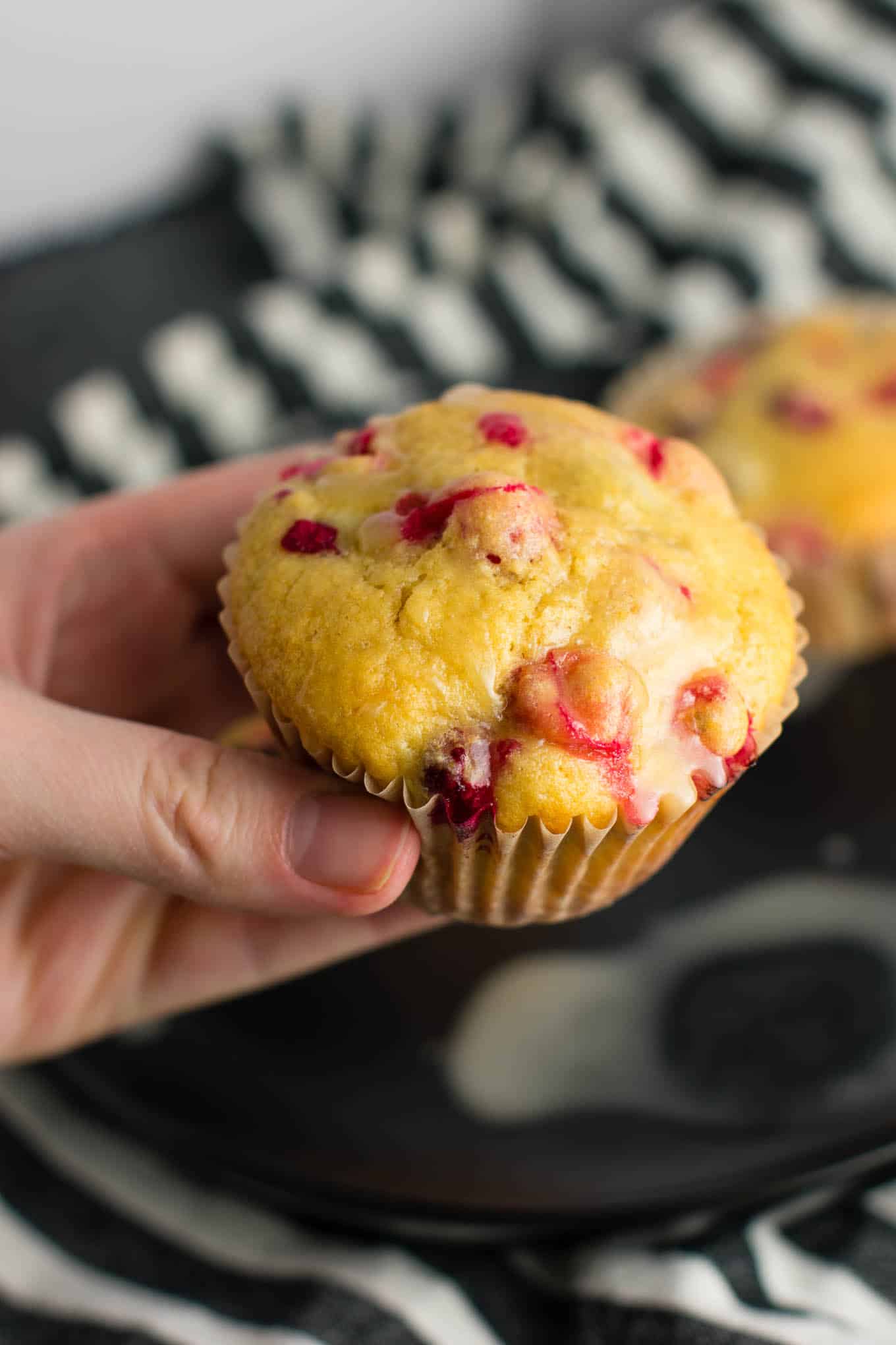 Healthy Cranberry Orange Muffins recipe made with greek yogurt and whole wheat pastry flour with a sweet orange glze. A healthier holiday breakfast or dessert! #breakfast #cranberry #muffins #cranberryorangemuffins #healthy