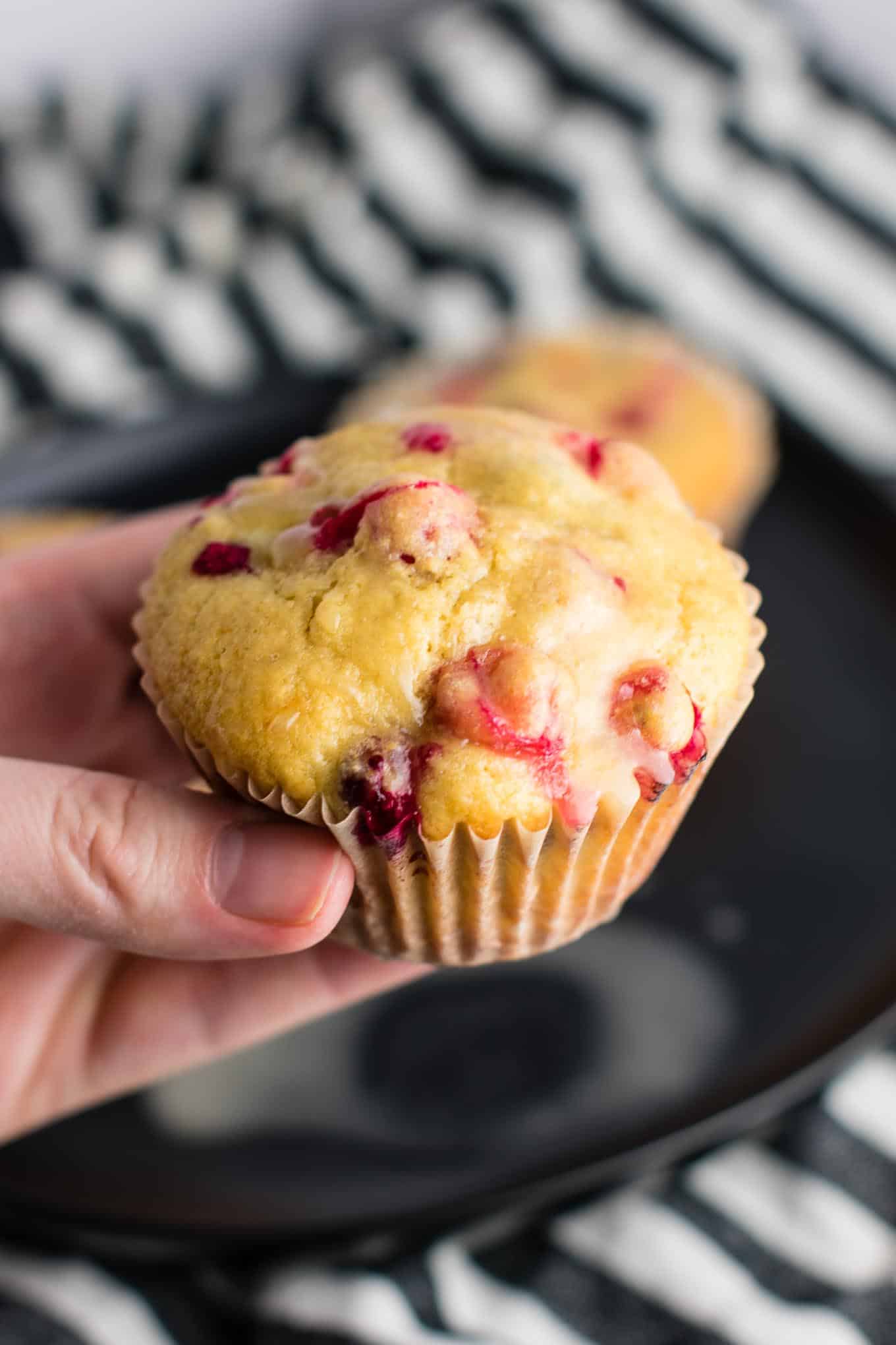 Healthy Cranberry Orange Muffins recipe made with greek yogurt and whole wheat pastry flour with a sweet orange glze. A healthier holiday breakfast or dessert! #breakfast #cranberry #muffins #cranberryorangemuffins #healthy