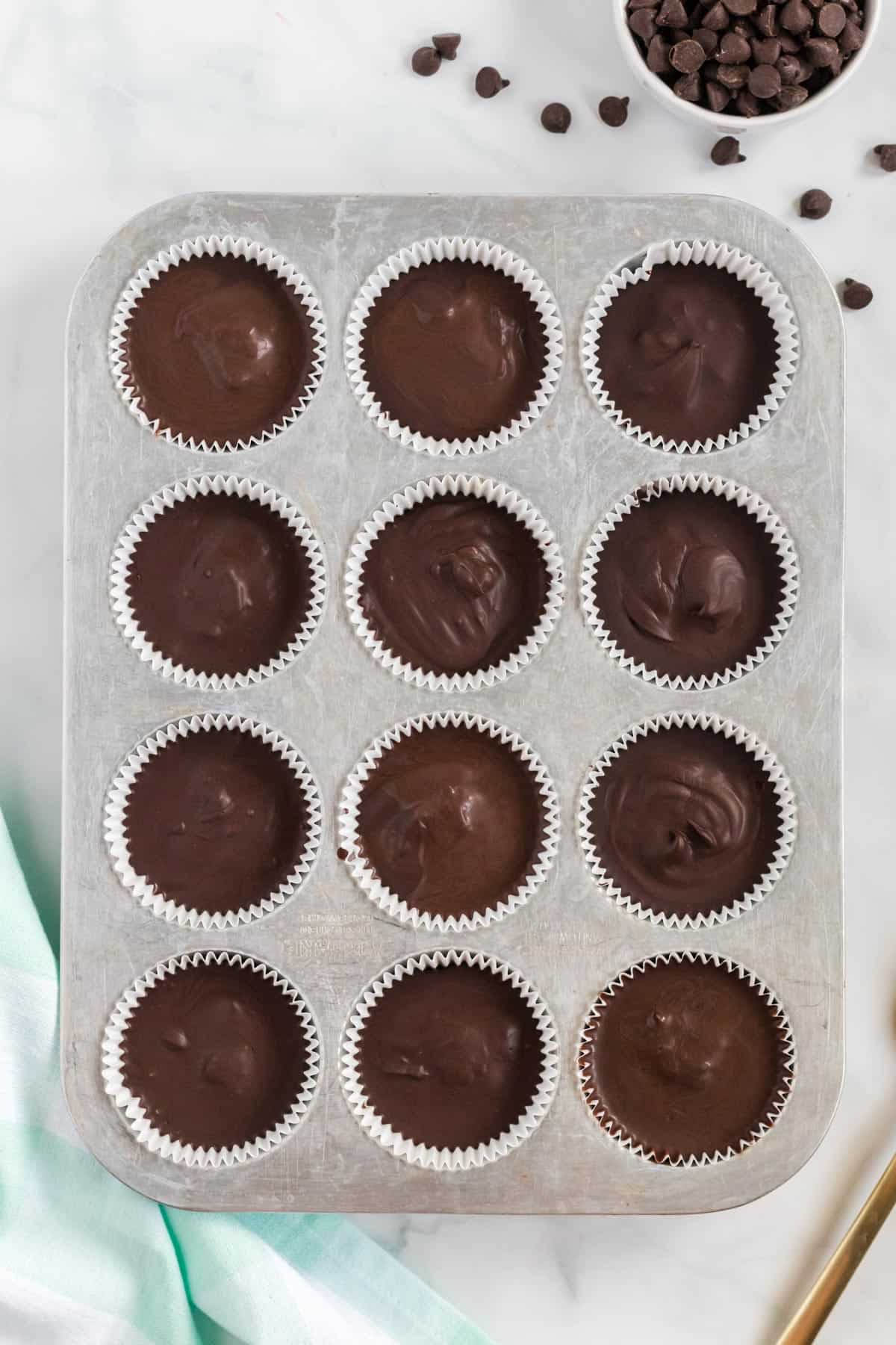 vegan peanut butter cups chilled in the muffin tin