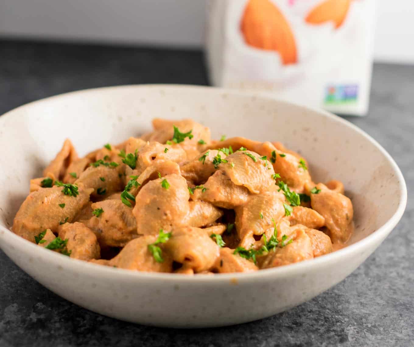 Creamy Tomato Shells are the ultimate vegan comfort food. Made with whole wheat pasta, and naturally creamy thanks to cashews and almond milk. You won’t believe how good this tastes! #vegan #creamsauce #creamytomatoshells #veganrecipe