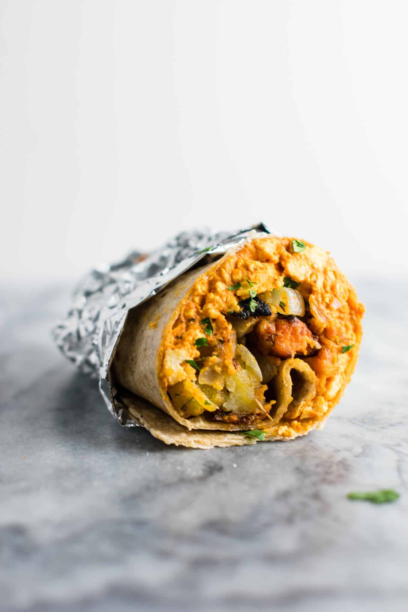 The BEST vegan breakfast burrito recipe you’ll ever try! Made with scrambled tofu and crispy vegan breakfast hash. #veganbreakfastburrito #veganbreakfast #vegan #breakfastburrito