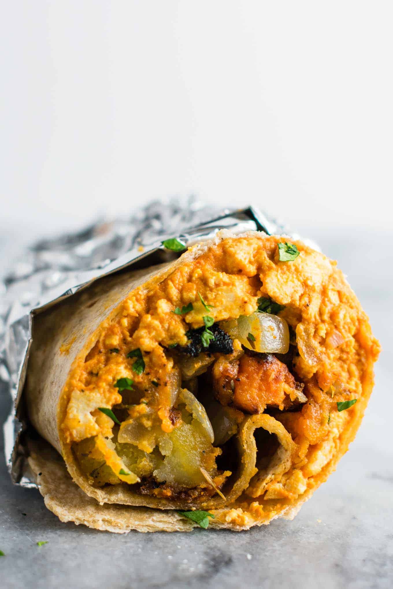 best vegan recipes - The BEST vegan breakfast burrito recipe with simple vegan breakfast hash you’ll ever try! Made with scrambled tofu and crispy vegan breakfast hash. #veganbreakfastburrito #veganbreakfast #vegan #breakfastburrito