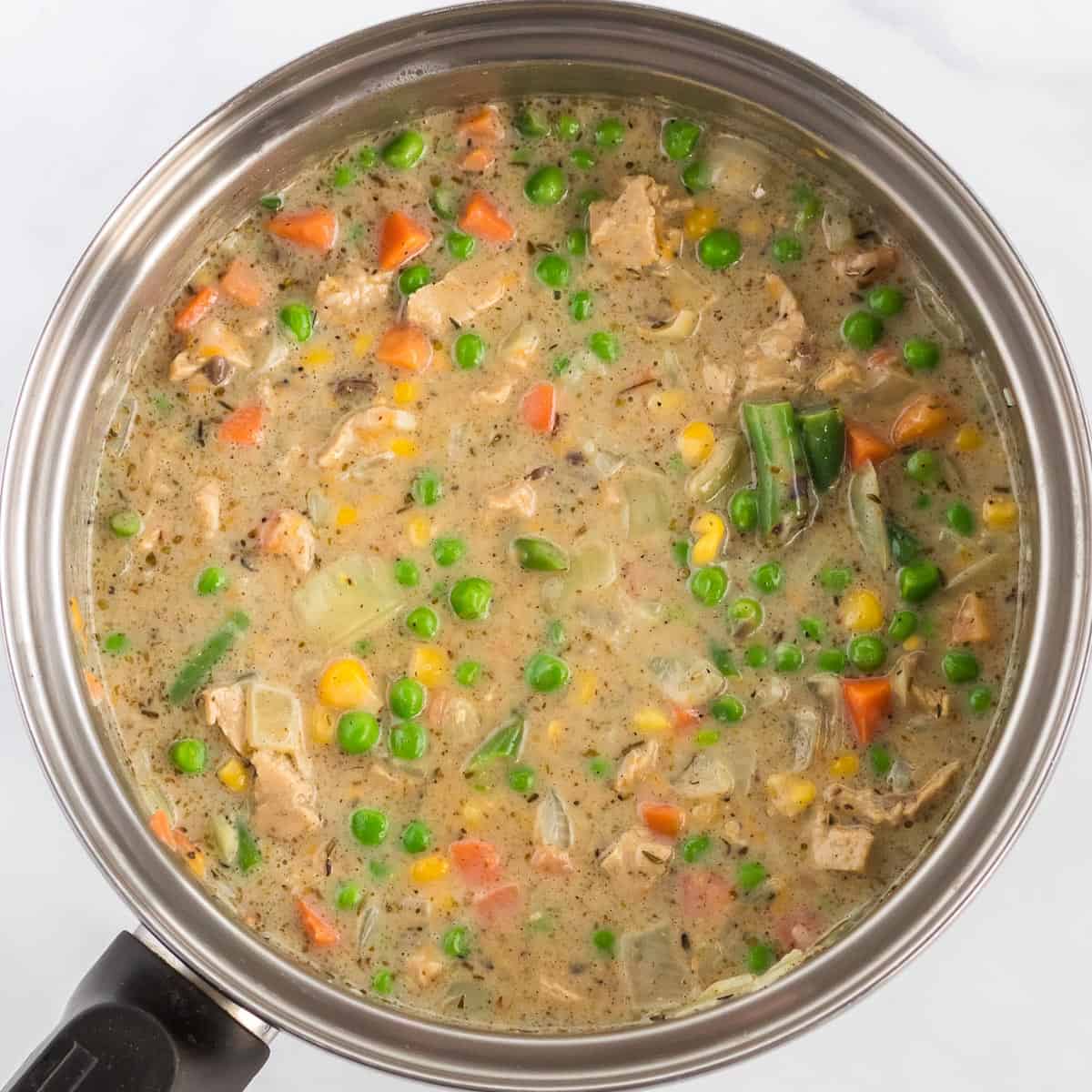 veggie pot pie filling in a sauce pan