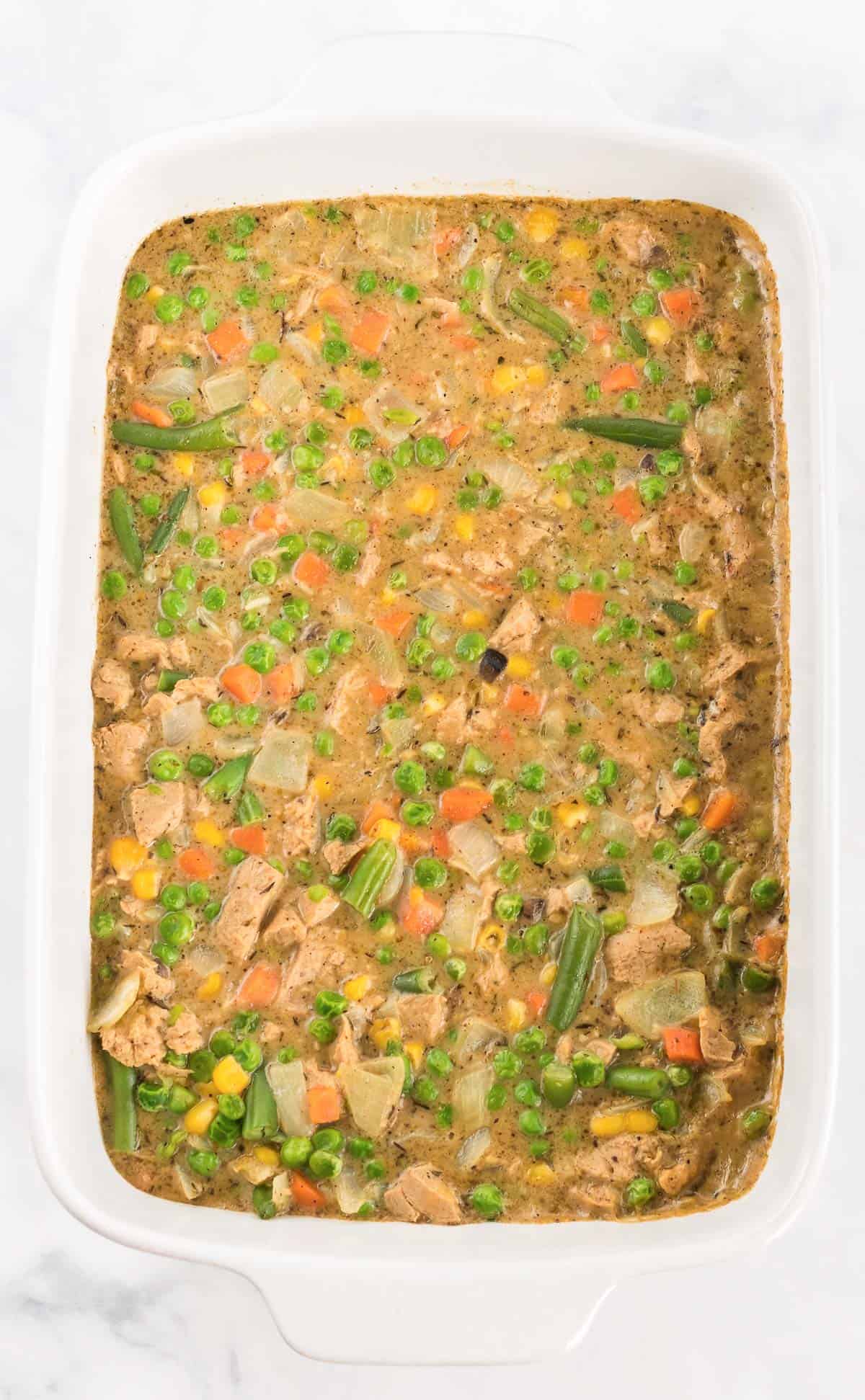 veggie pot pie filling in a casserole dish