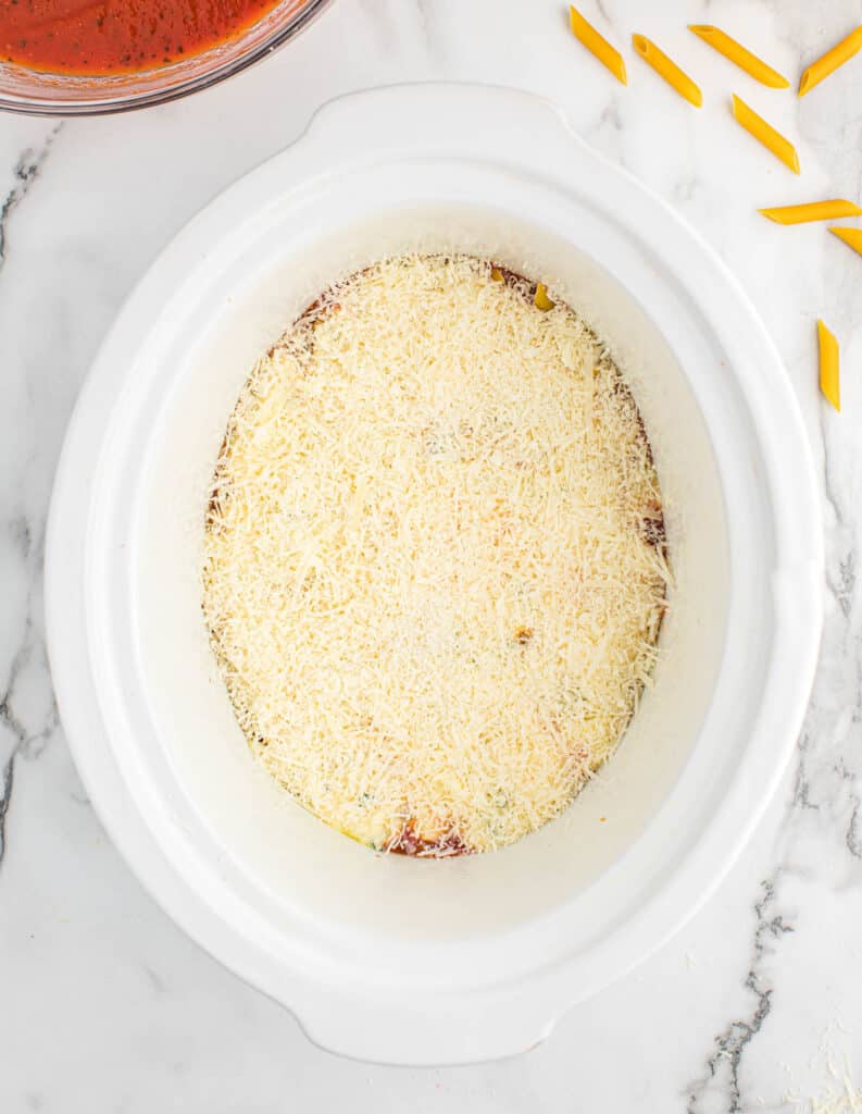 parmesan cheese layer added to the slow cooker