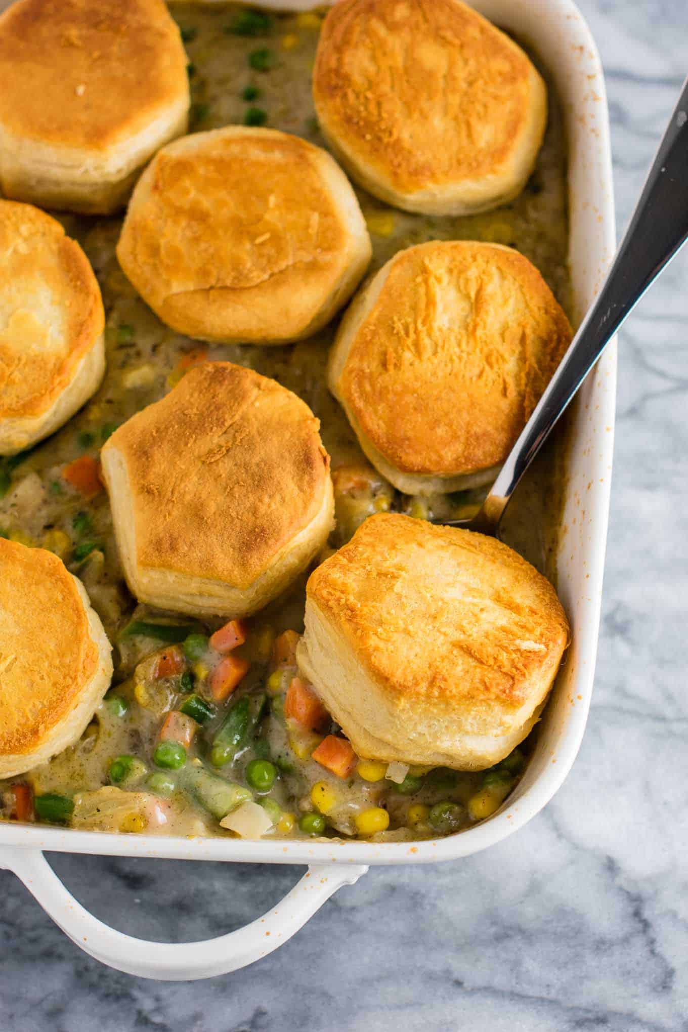 Deconstructed Veggie Pot Pie Recipe with flaky biscuits on top. A delicious twist on a classic recipe that is so simple to make. Easy delicious meatless dinner! #veggiepotpie #vegetarian #meatless #dinner #healthydinner