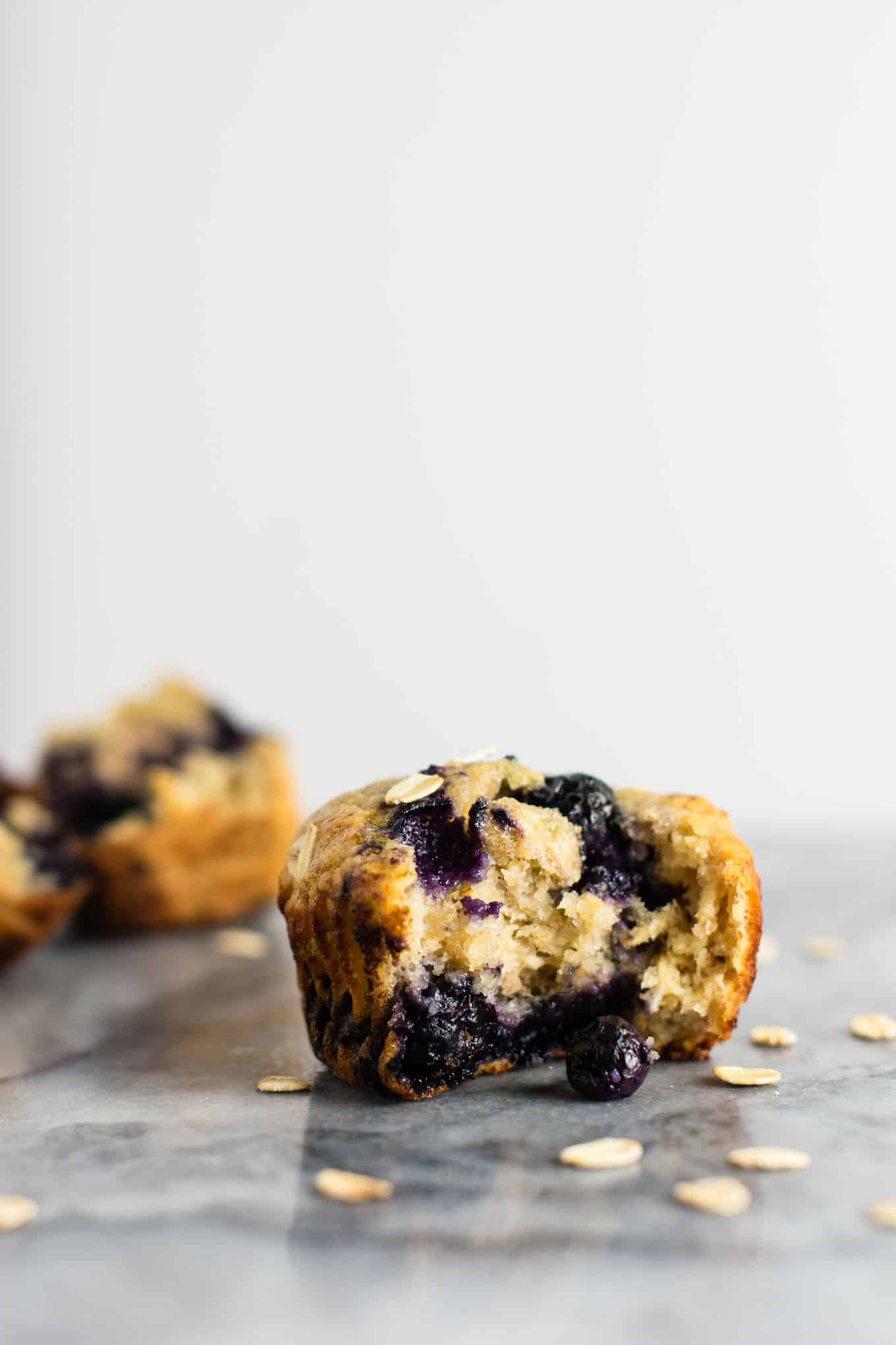 Healthy Blueberry Muffins with greek yogurt and coconut oil. Melt in your mouth crazy delicious! A protein packed healthy breakfast on the go. #healthyblueberrymuffins #blueberrymuffins #breakfast #greekyogurt #healthybreakfast